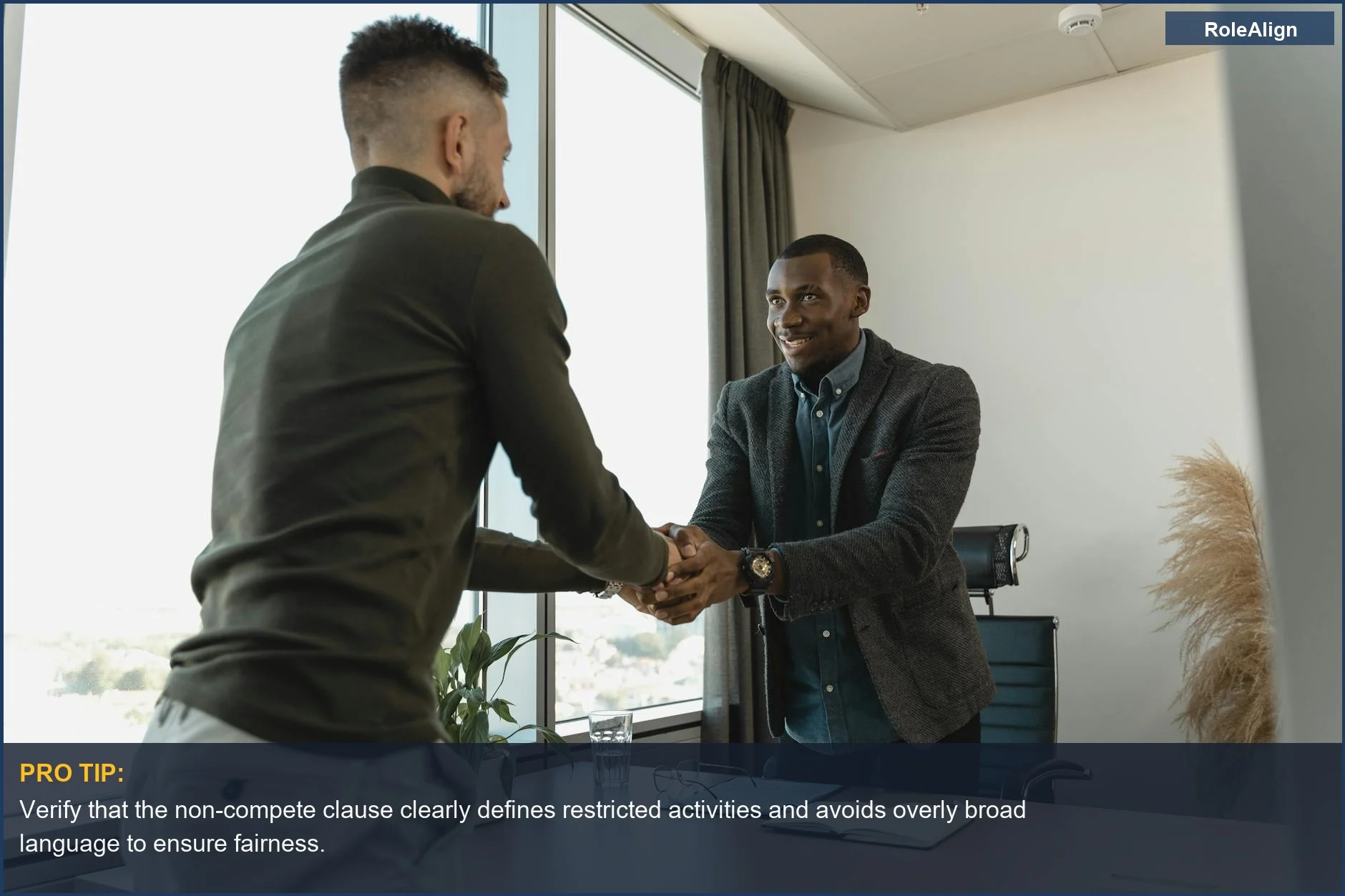 Two businessmen exchanging a handshake in a modern office, highlighting professional negotiation for non-compete clauses.