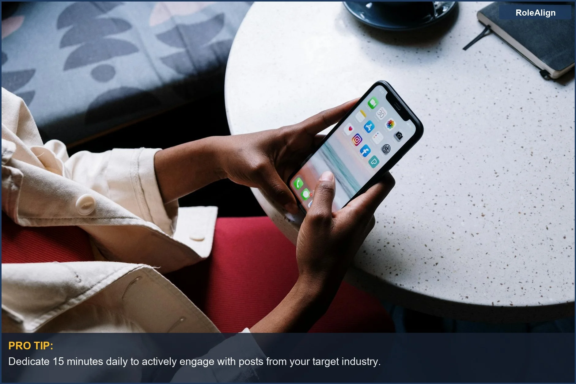 Person checking social media on smartphone, emphasizing strategic LinkedIn engagement for job success.