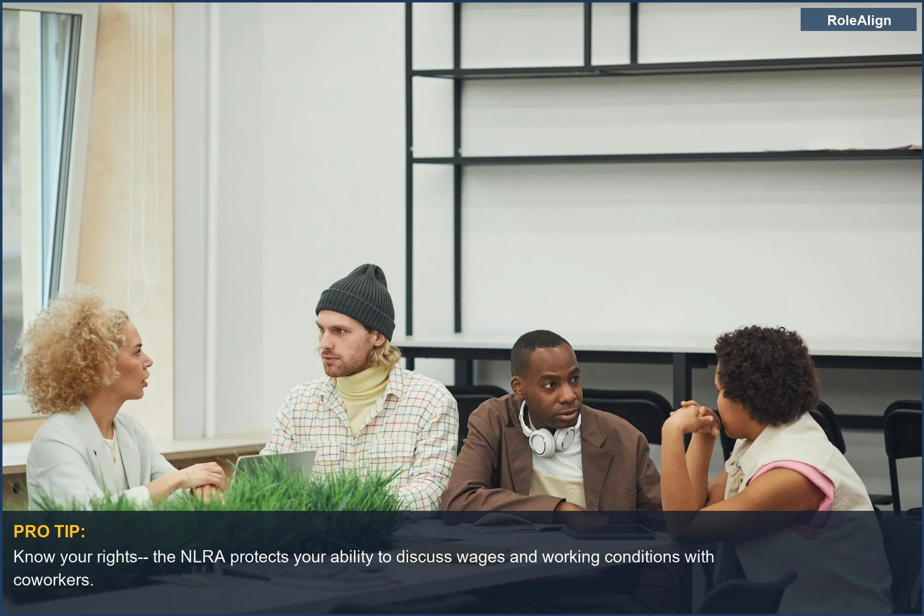 Diverse colleagues in a modern office discussing workplace rights, including salary talk.