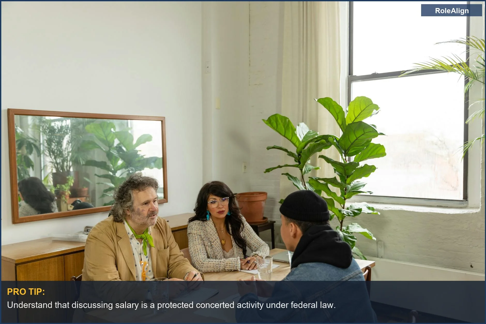 Team brainstorming in a modern office, emphasizing collaboration and protected salary discussions.