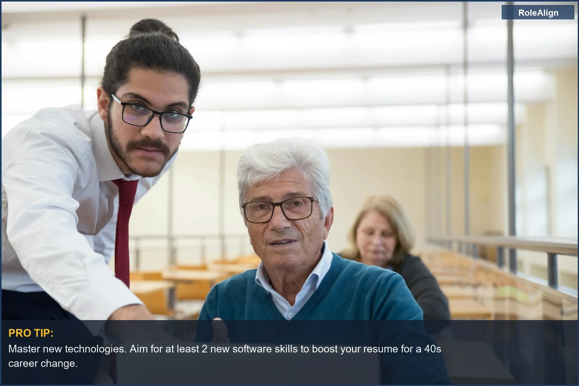 Elderly man learns computer skills with teacher, illustrating tech education for career change at 40.
