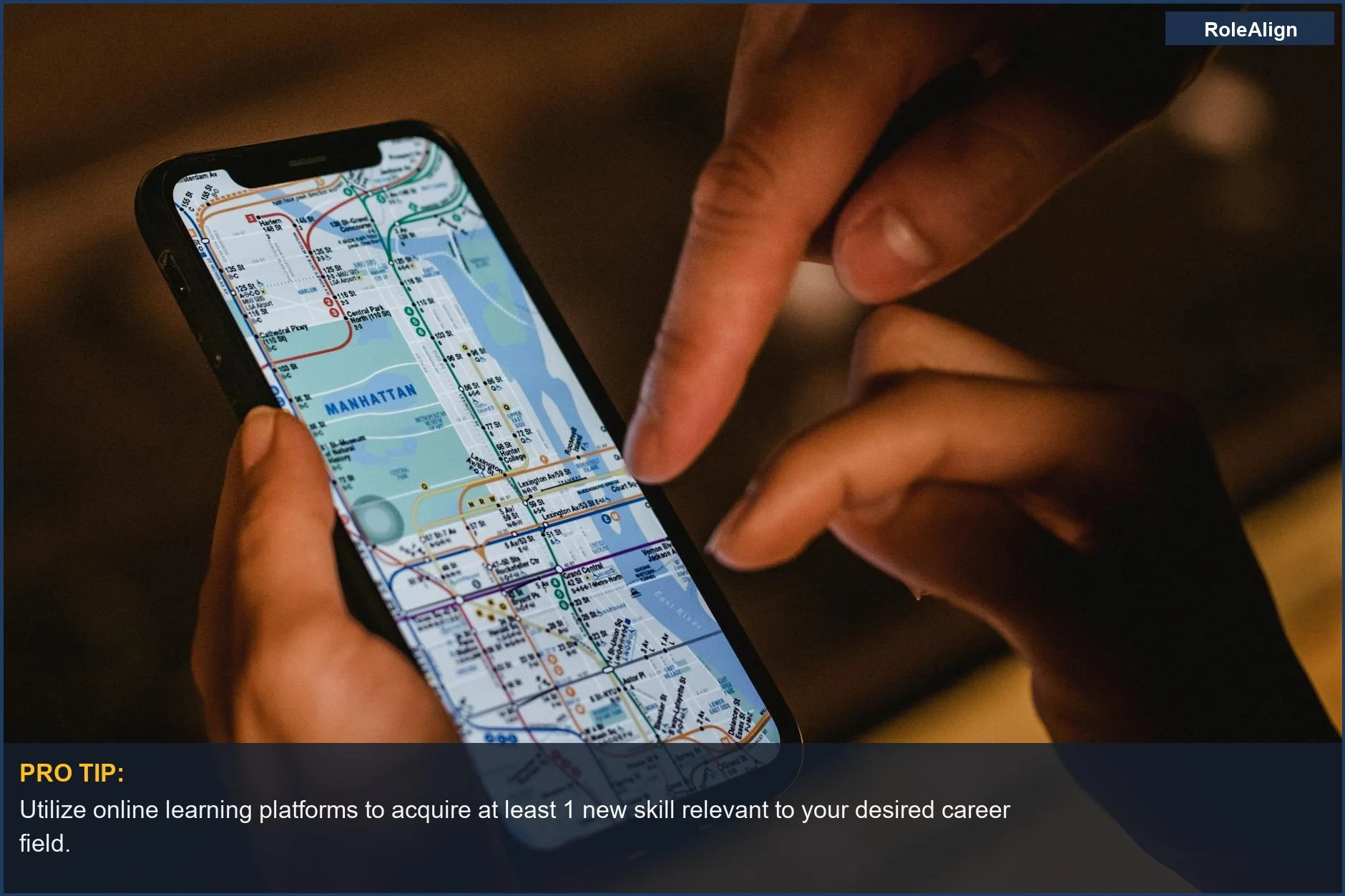 Hands using a smartphone with a New York City subway map, representing modern navigation and career transitions.