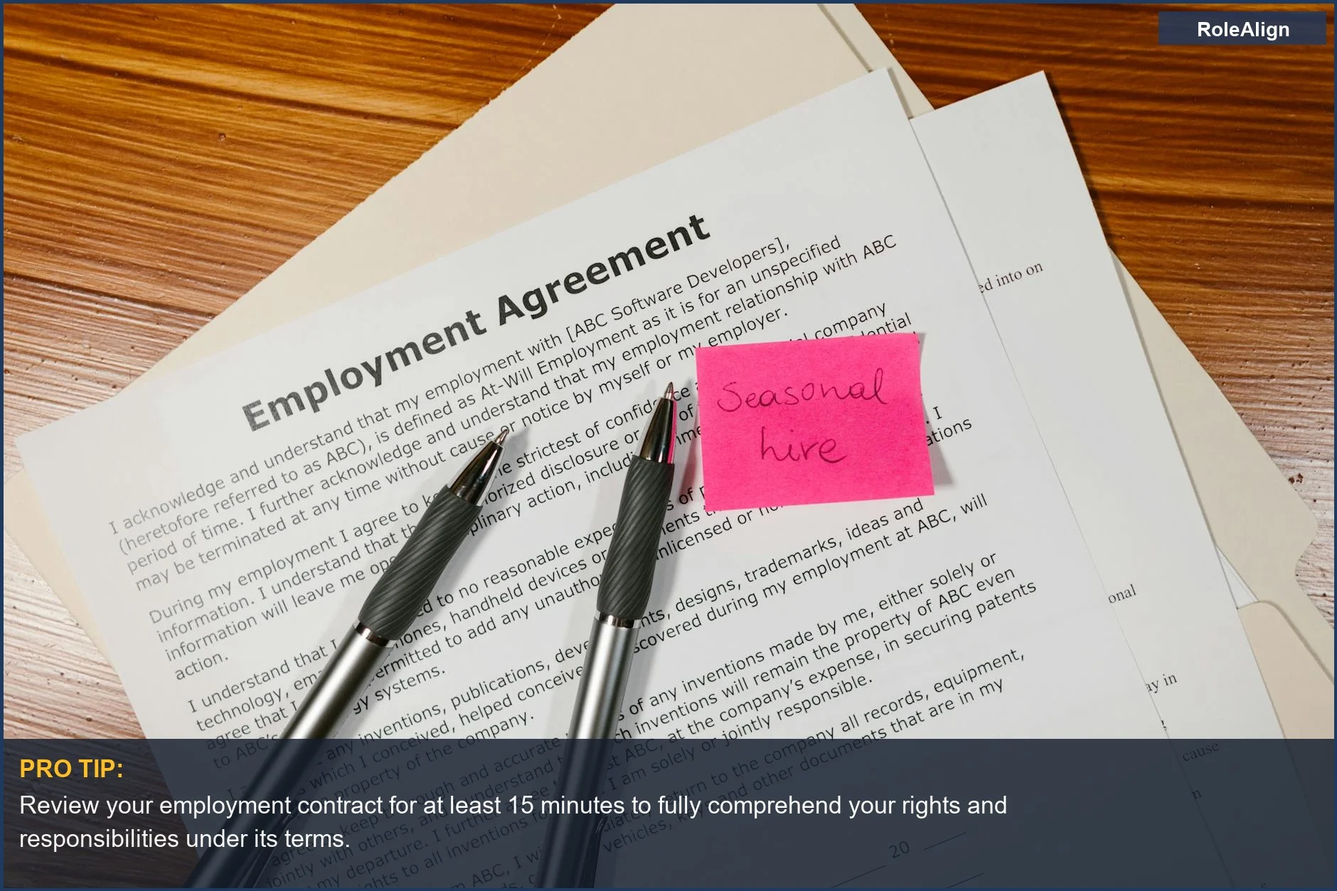 Overhead view of an employment agreement contract with pens, highlighting the importance of understanding workplace duties.