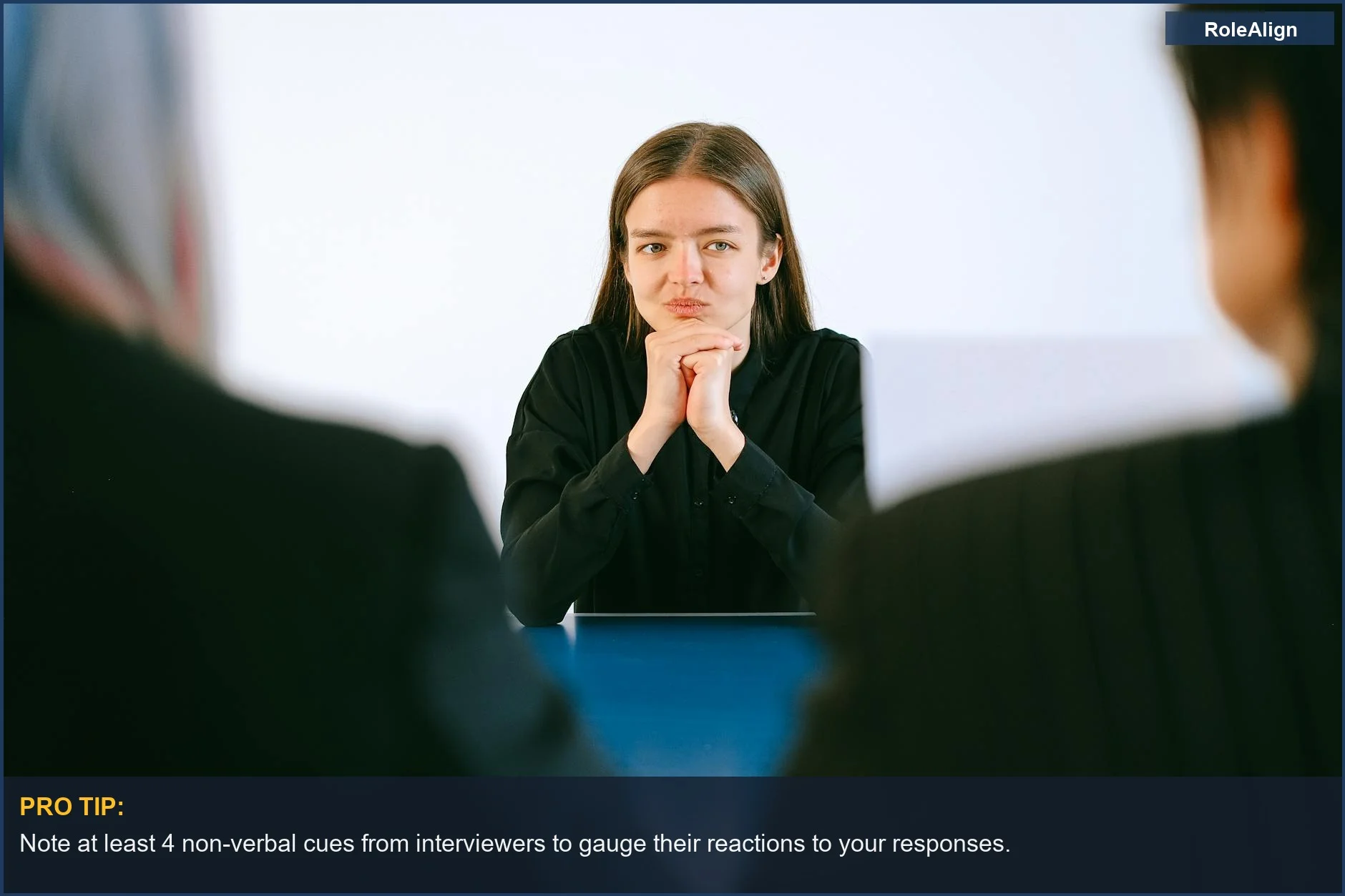 Intense panel interview scene with a woman facing two interviewers at an office table.