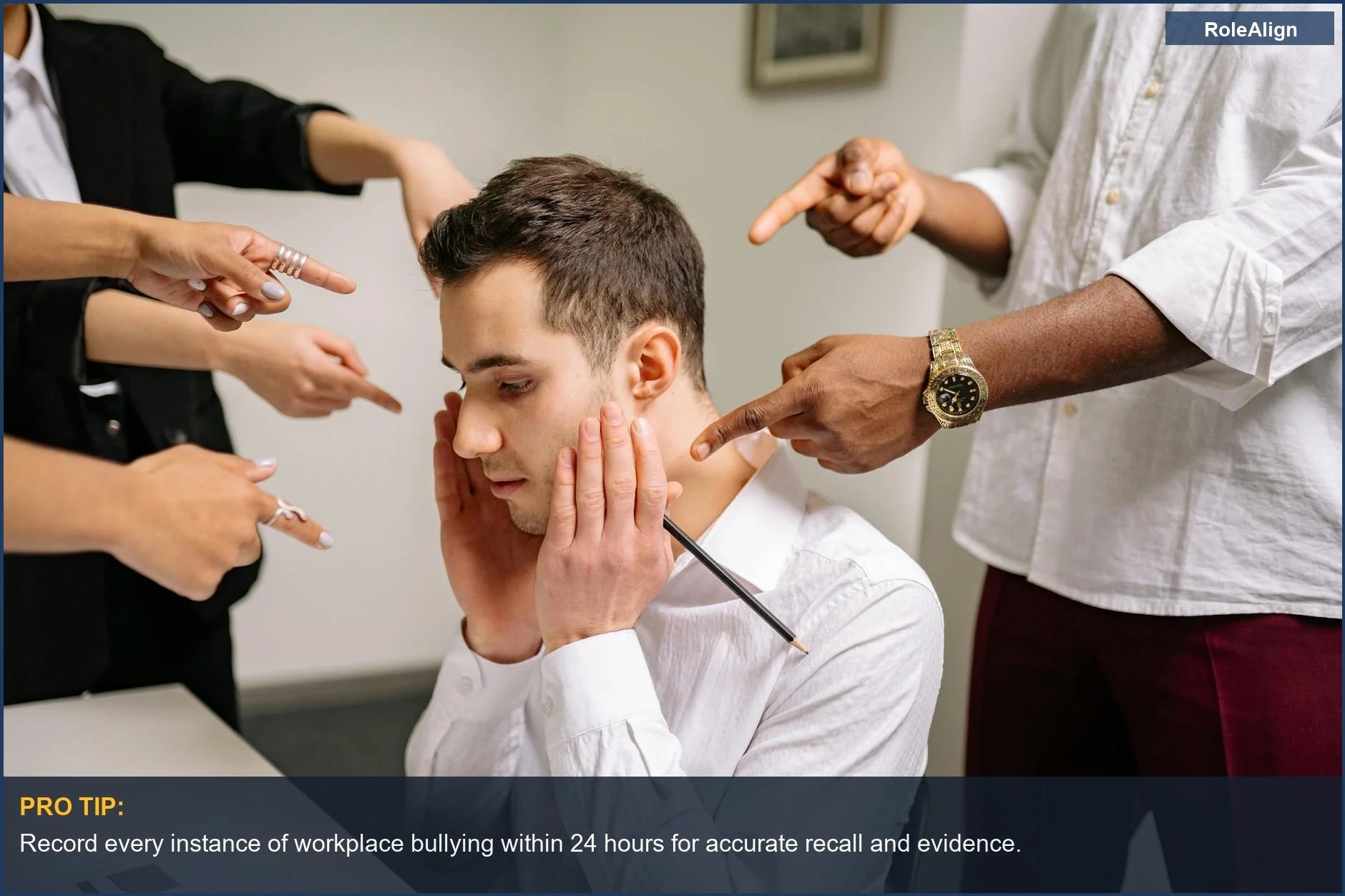 Stressed man in office surrounded by pointing fingers, symbolizing workplace discrimination and stress.