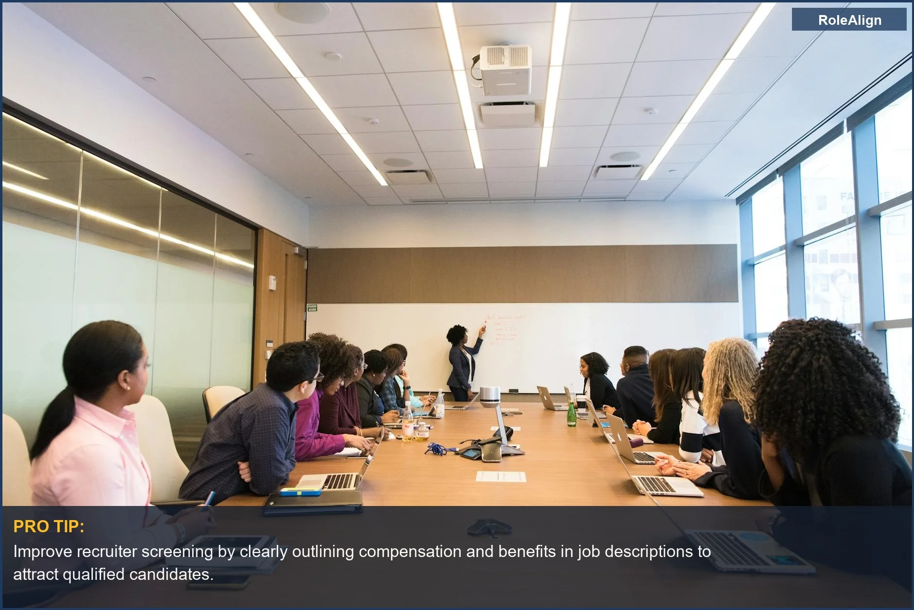 Business team discussing projects, emphasizing effective communication for employee benefits and compensation strategies.