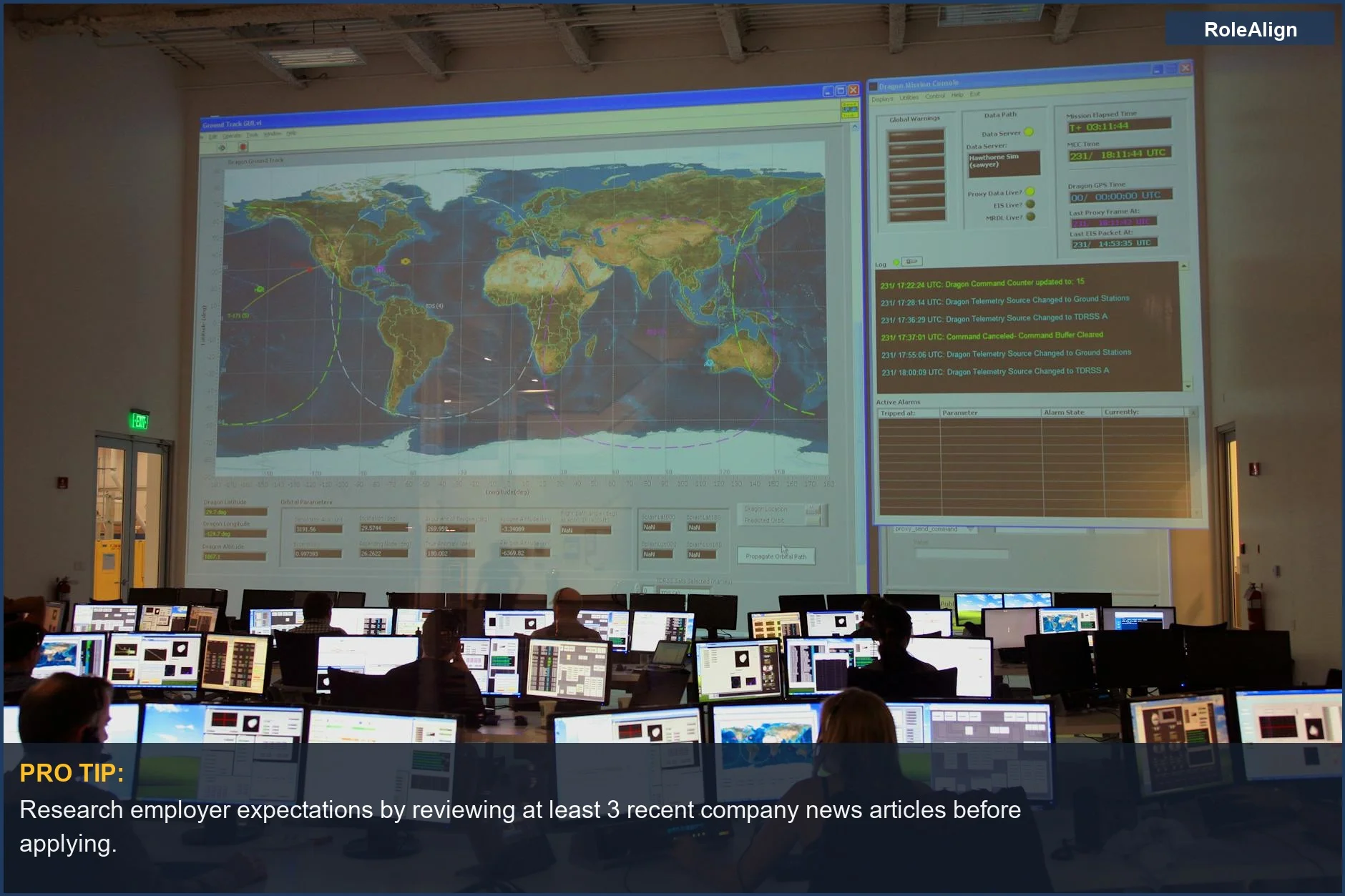 Back view of employees working in a control room, illustrating a focus on shared goals and employer expectations.