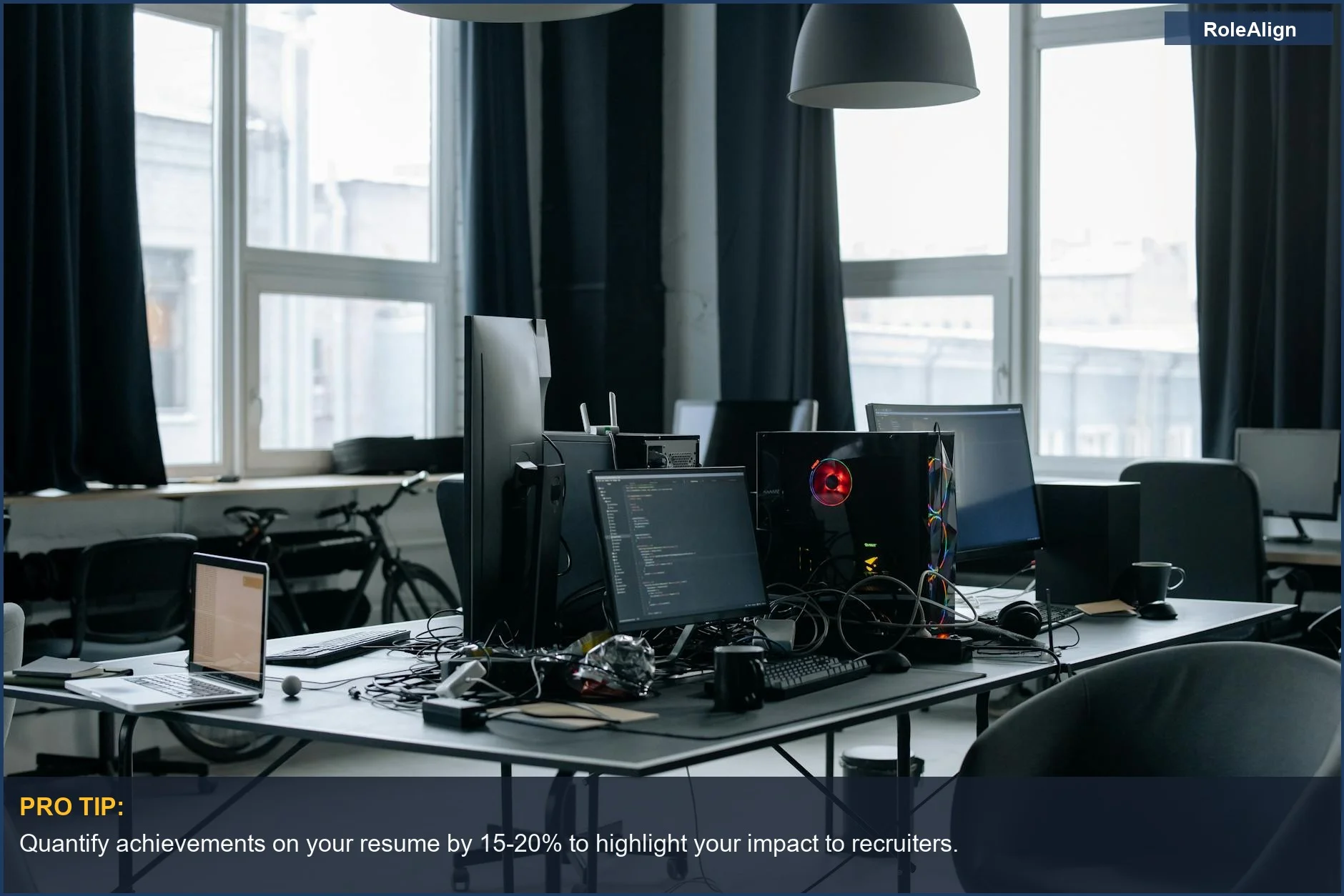 Tech job seeker in a contemporary workspace with coding screens and office essentials.