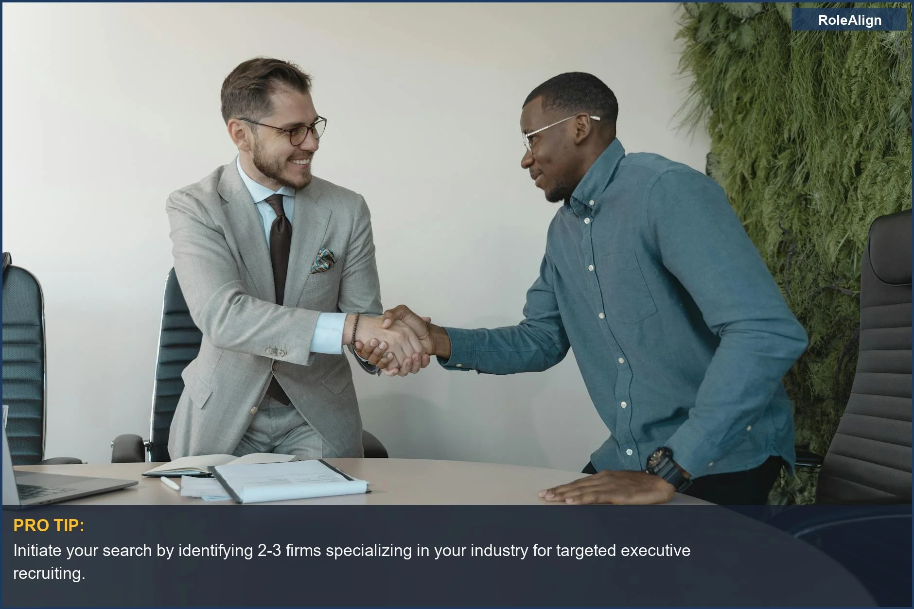 Two executives shake hands, symbolizing the crucial first step in connecting with relevant executive recruiters.