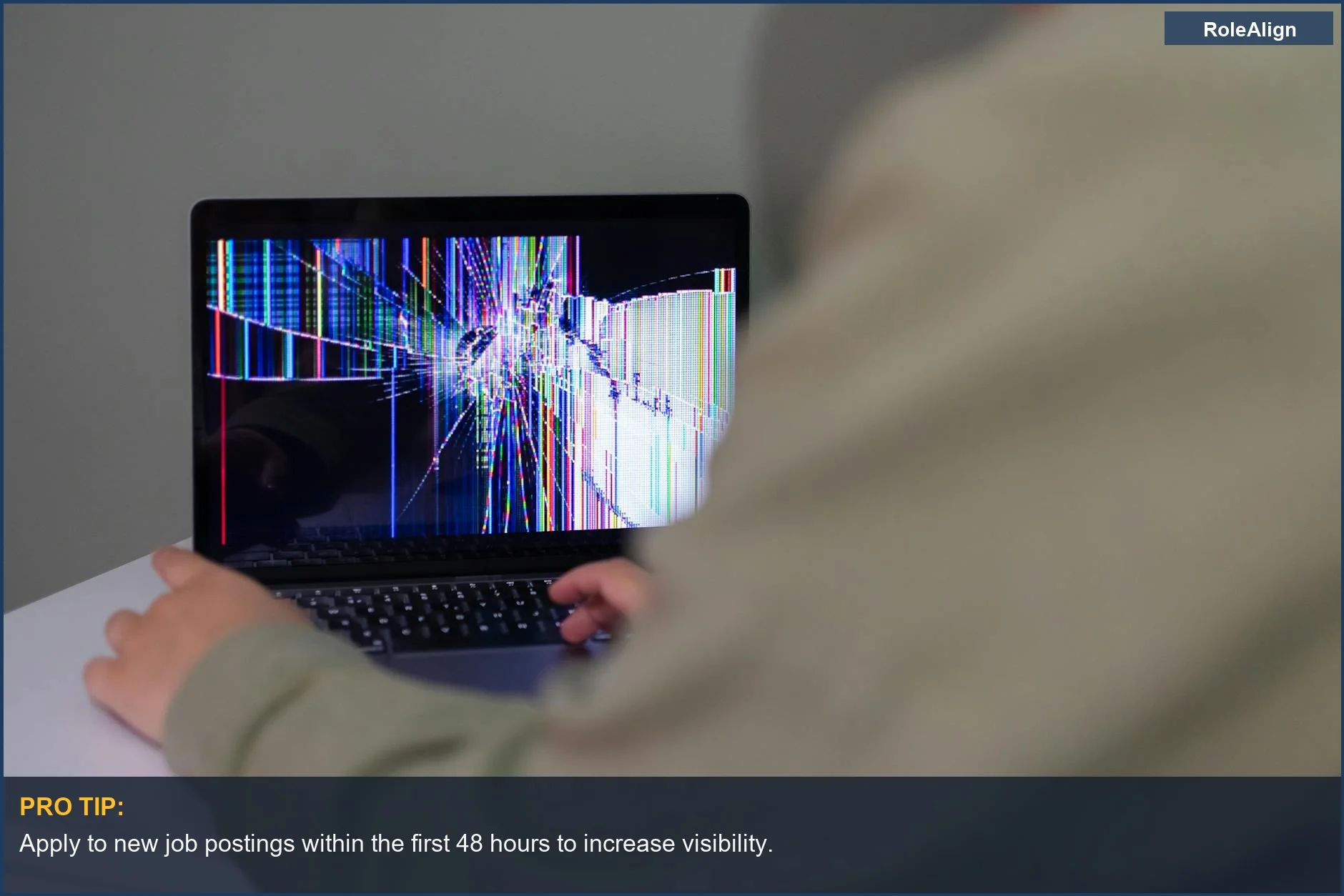 Person using a laptop with a cracked screen, representing the frustration of ghost jobs.