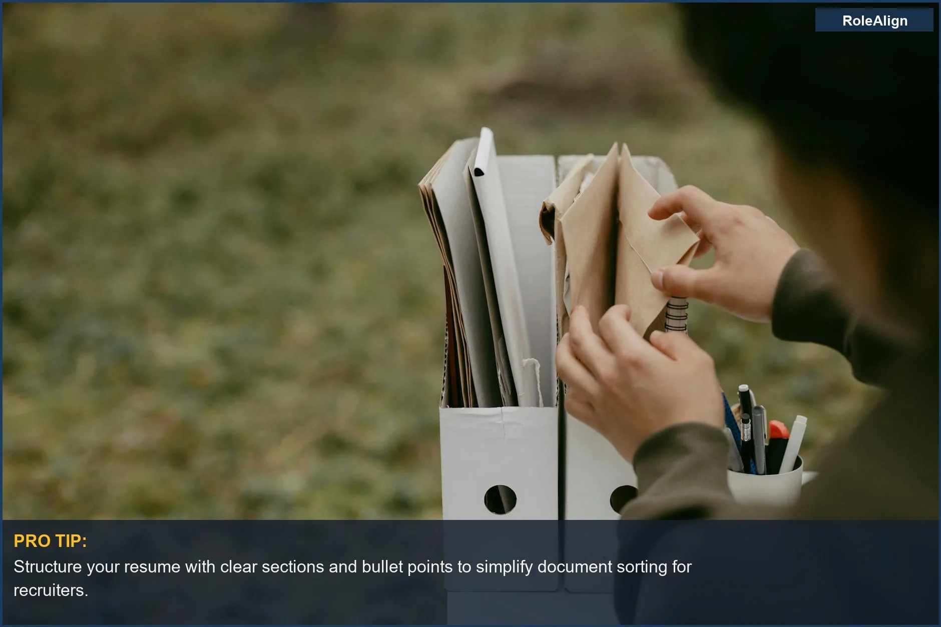 Person sorting documents in folders, representing organized candidate data in the Google recruiter hiring process.