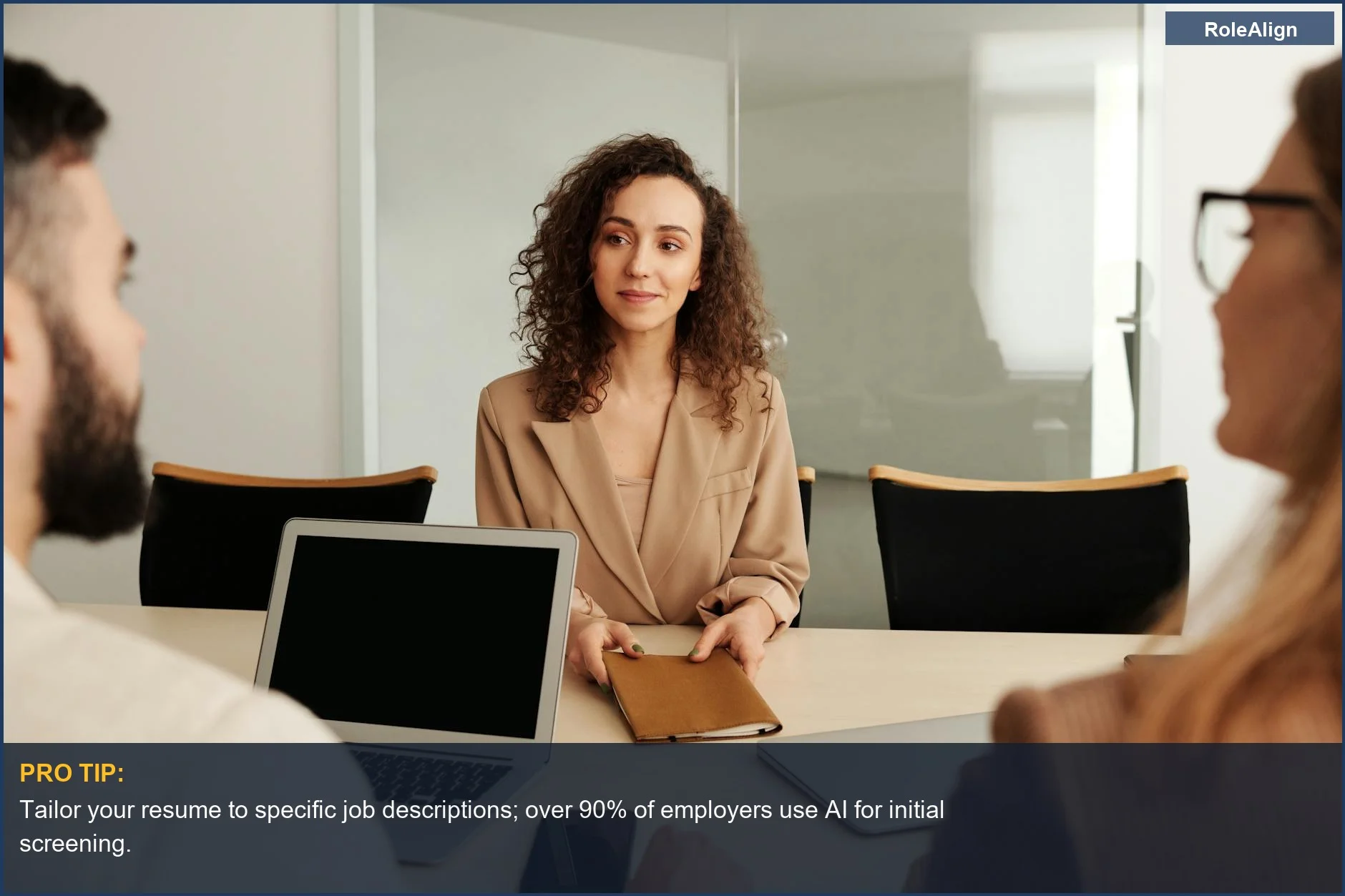 Woman in a suit in a modern office, representing candidates facing automated resume review.