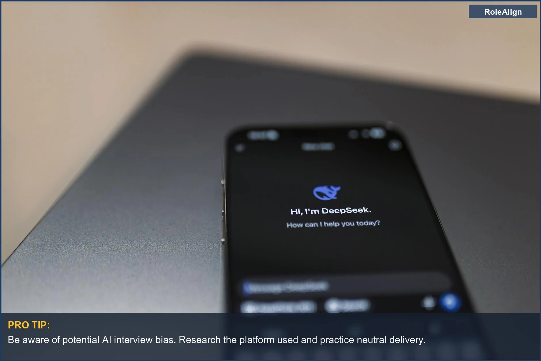 Close-up of a smartphone showing an AI assistant interface over a laptop, representing AI interview bias.