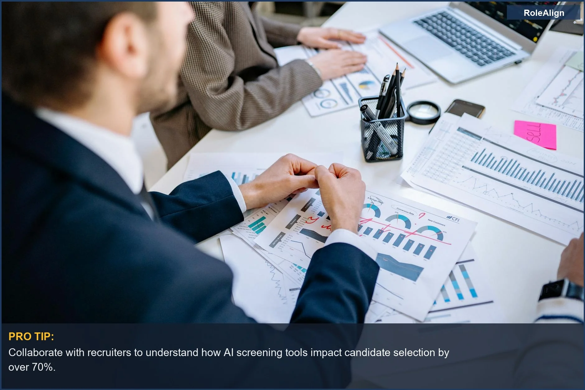 Business team analyzes financial graphs, illustrating how ATS evolution impacts recruitment strategy and collaboration.