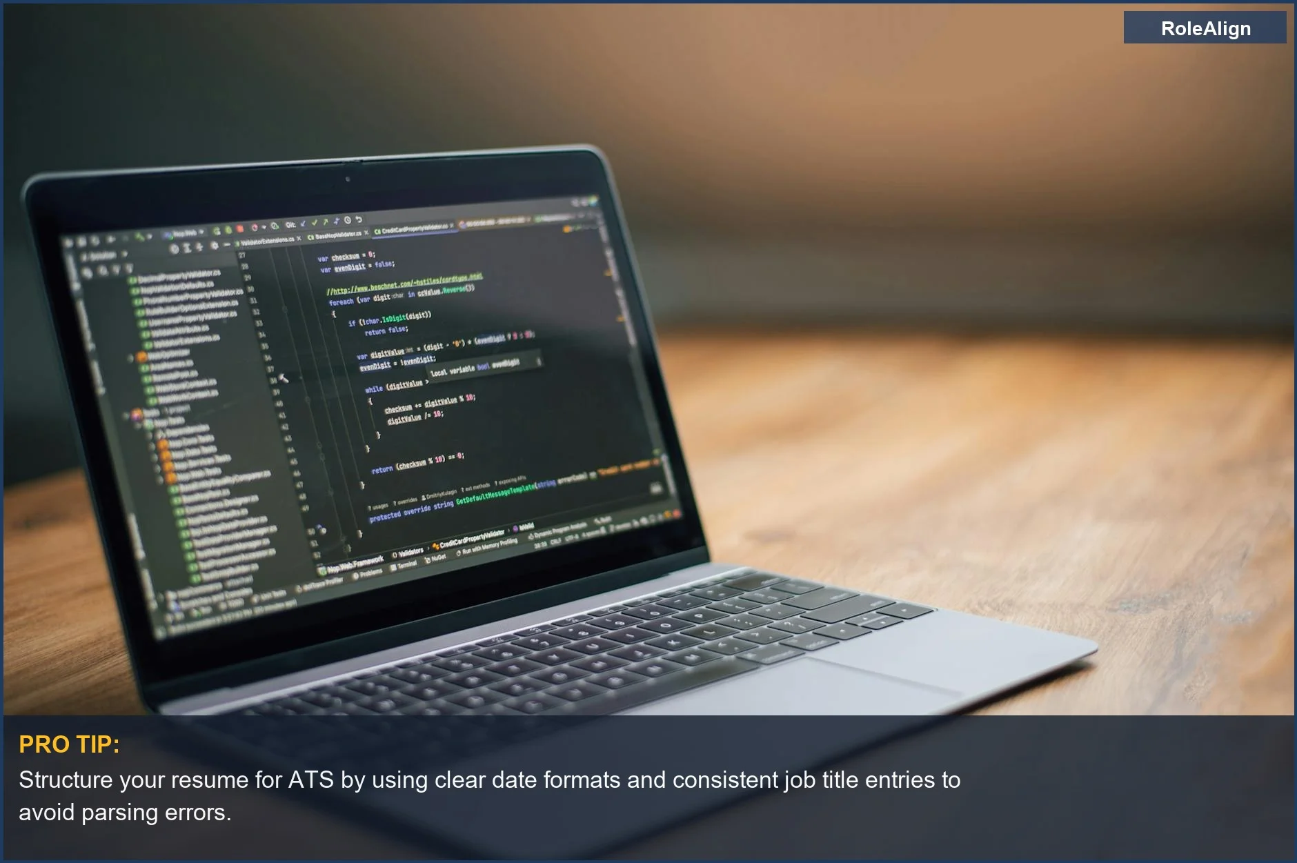 Laptop displaying software code on a wooden table, showing the data structure importance for ATS career gap handling.