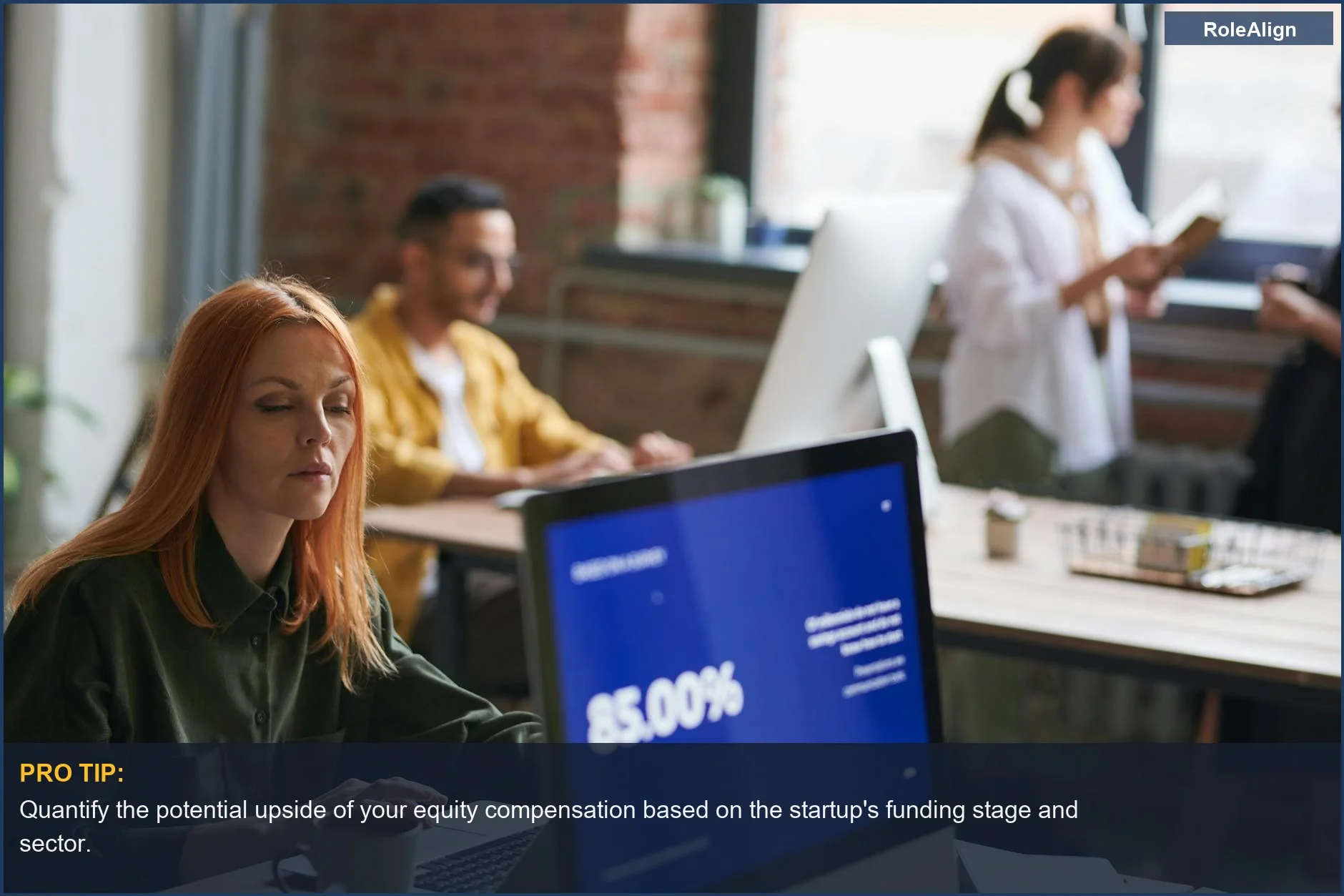 Professionals in a modern coworking space focused on growth, demonstrating the impact of equity compensation on retention.