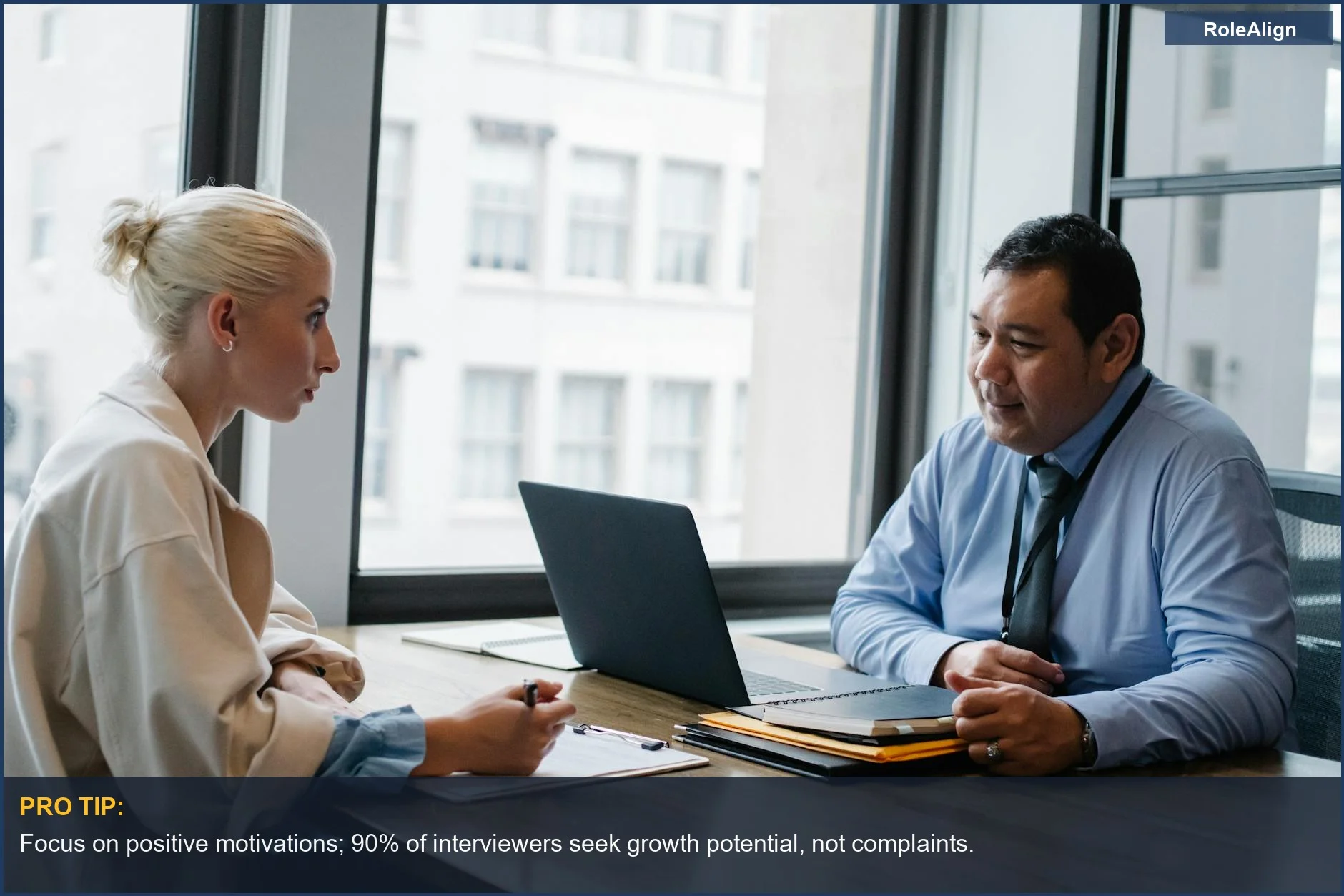 Professionals discuss the interview question: why are you leaving your current job in a modern office.