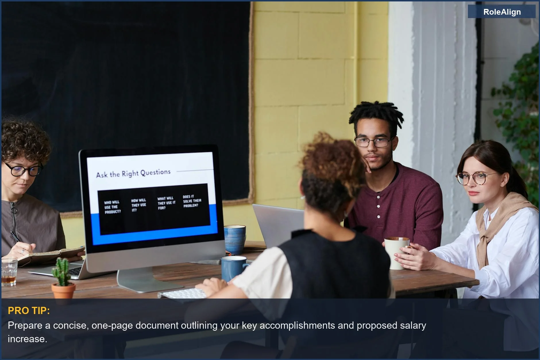 Diverse team brainstorms ideas with computer prompts, representing how to effectively present your case for a salary raise.