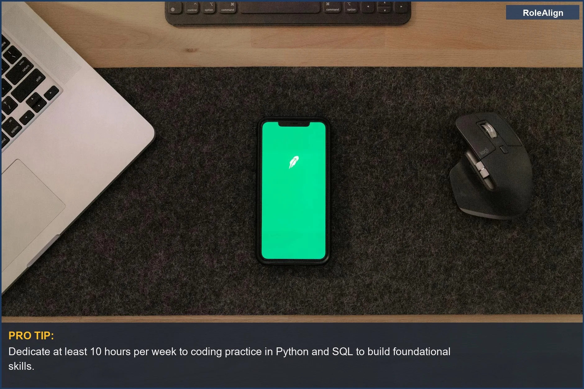 Desk with smartphone, laptop, and mouse, supporting the journey to an AI job with no degree required.