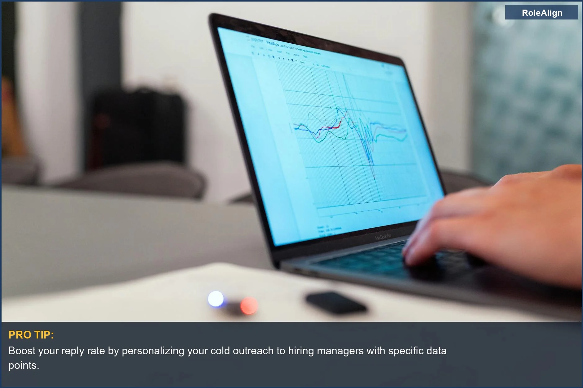 Person analyzing data on laptop, demonstrating personalized cold outreach for hiring managers.