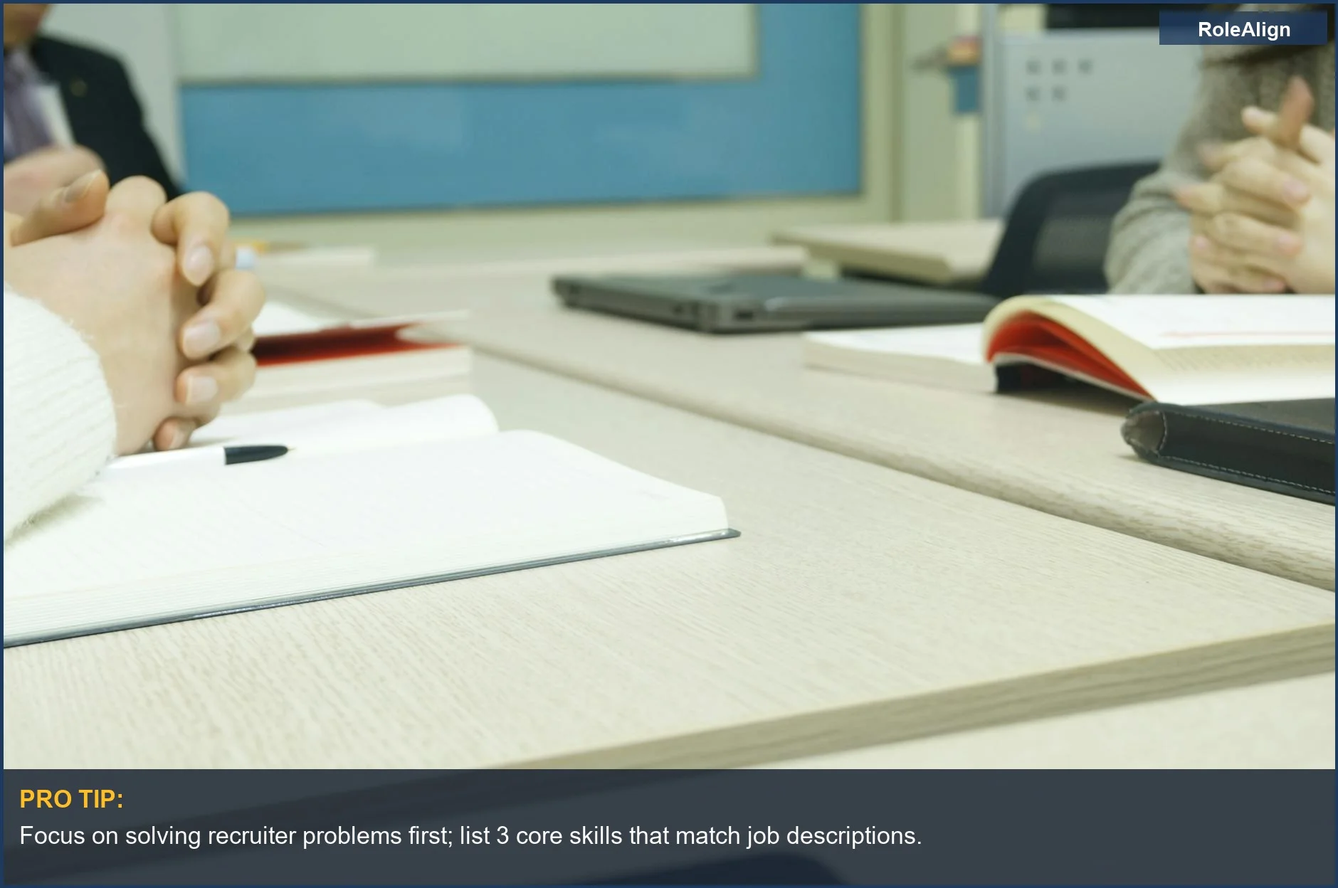 Professional meeting setup with hands on laptops and notebooks, highlighting how to craft a compelling LinkedIn summary.