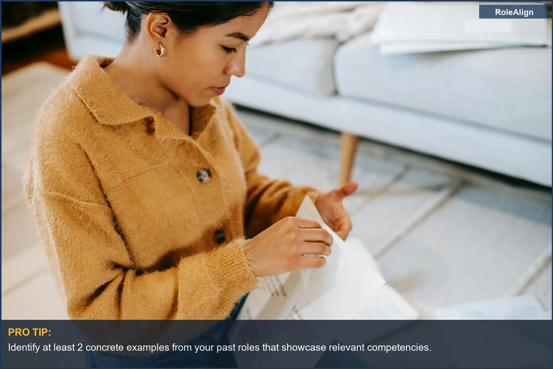 Young woman reviewing career transition documents at home, preparing for interviews.