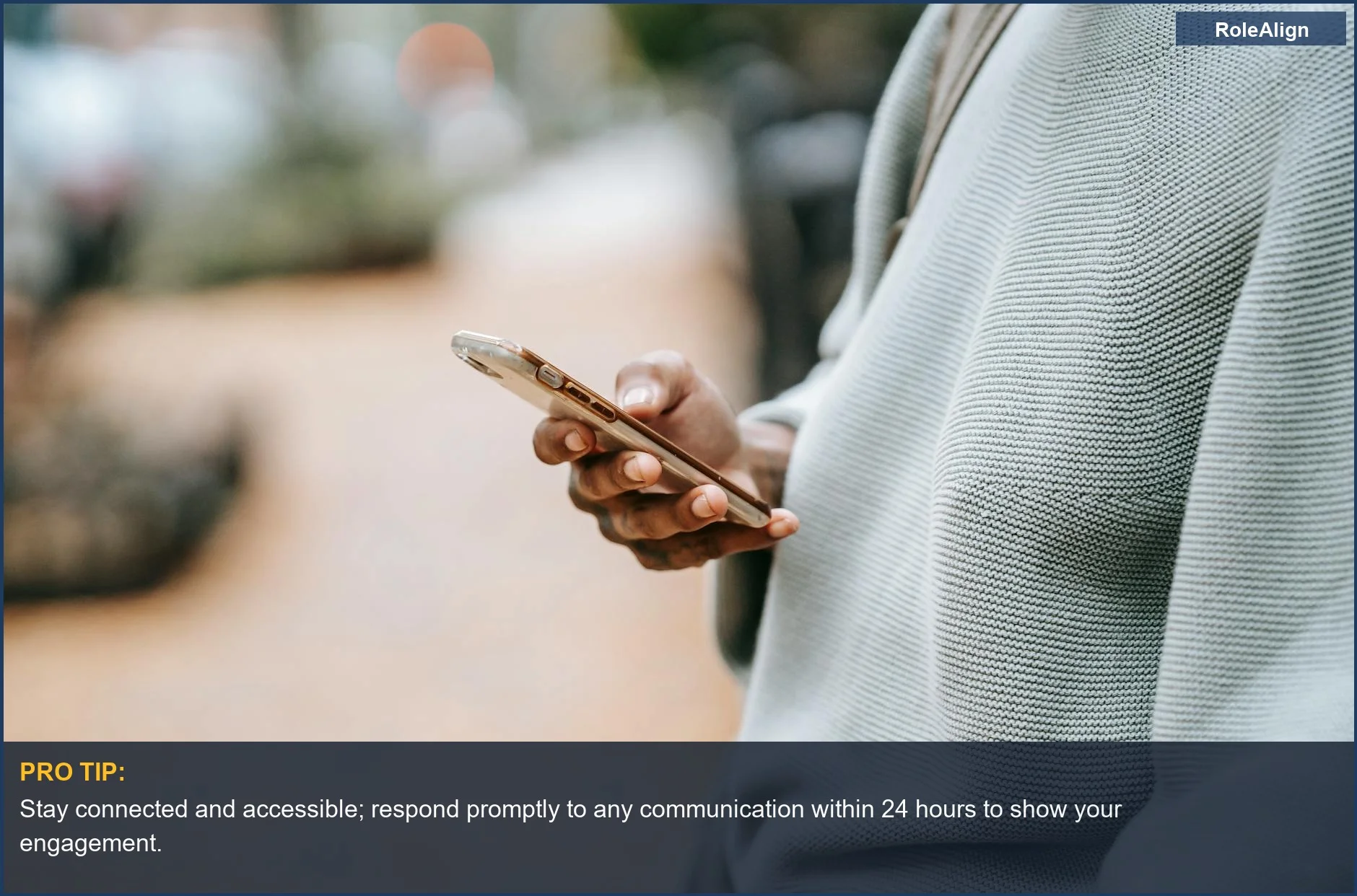 Person connecting via smartphone outdoors, demonstrating how to follow up after a job interview with a modern approach.