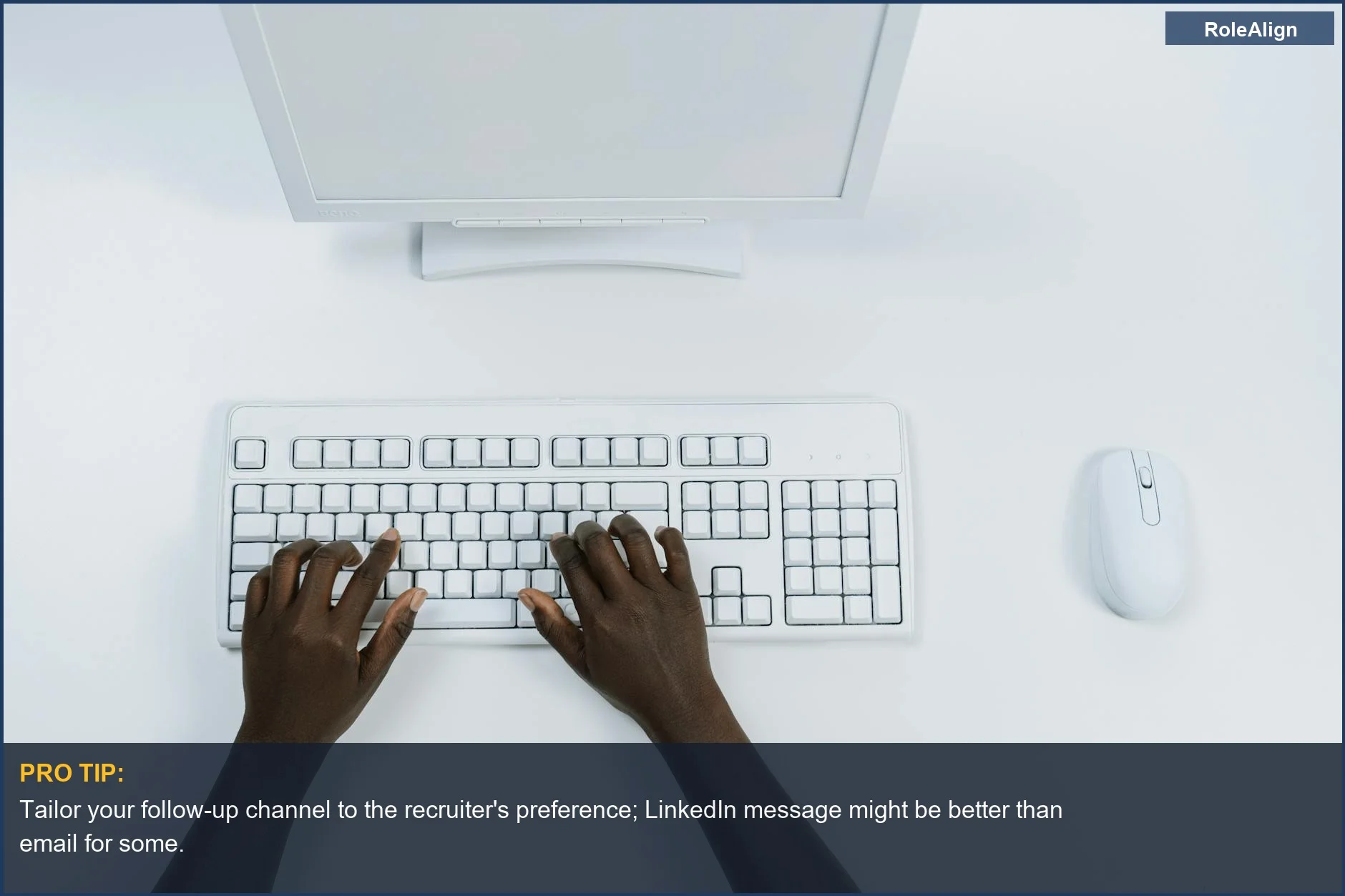 Overhead view of hands typing on a laptop, symbolizing professional communication for interview follow up timing.