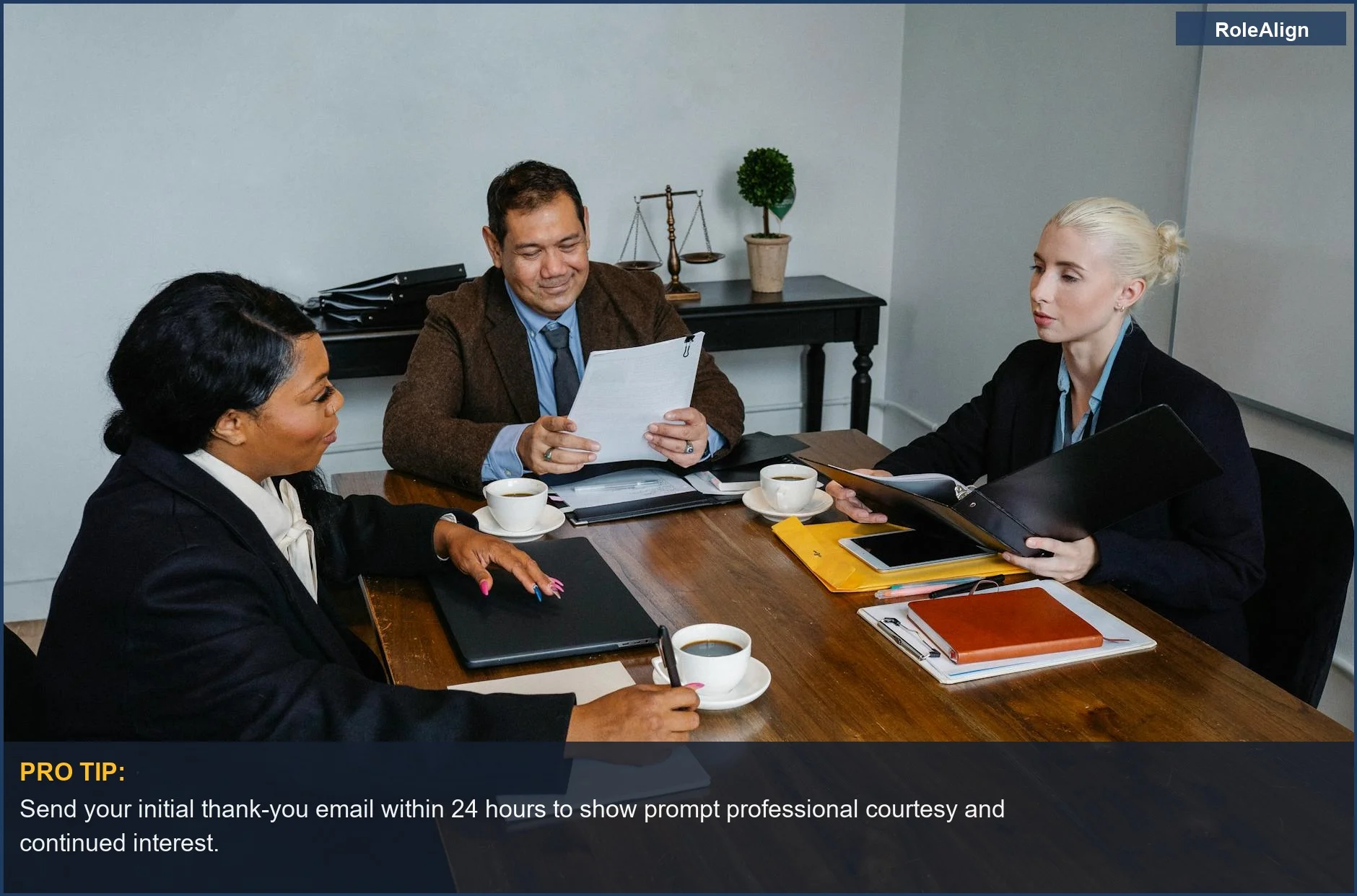 A diverse group of professionals discussing business strategies, illustrating proactive communication for interview follow-up.