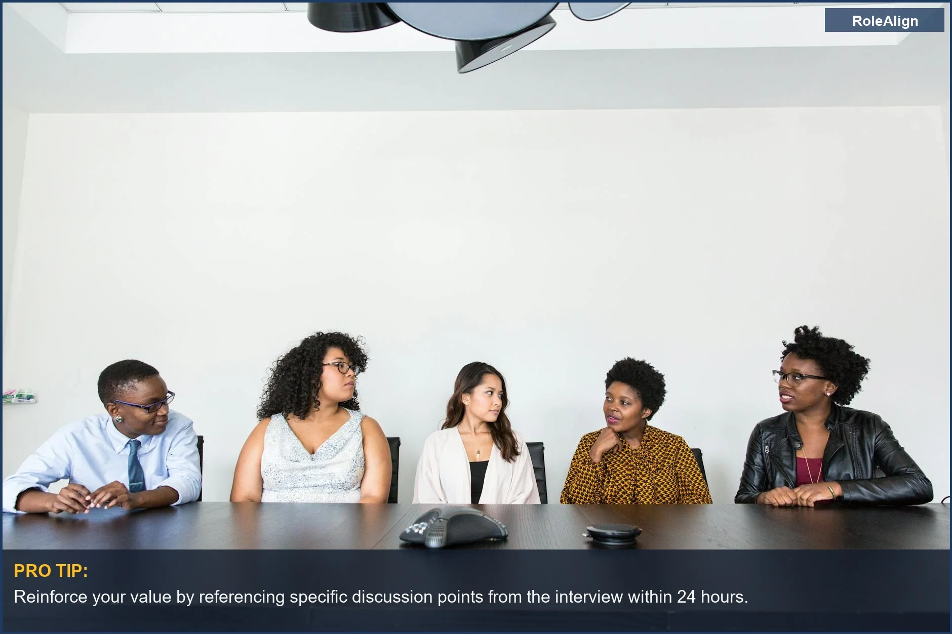 Diverse professionals collaborating in a modern office, showcasing effective teamwork during an interview follow-up strategy session.