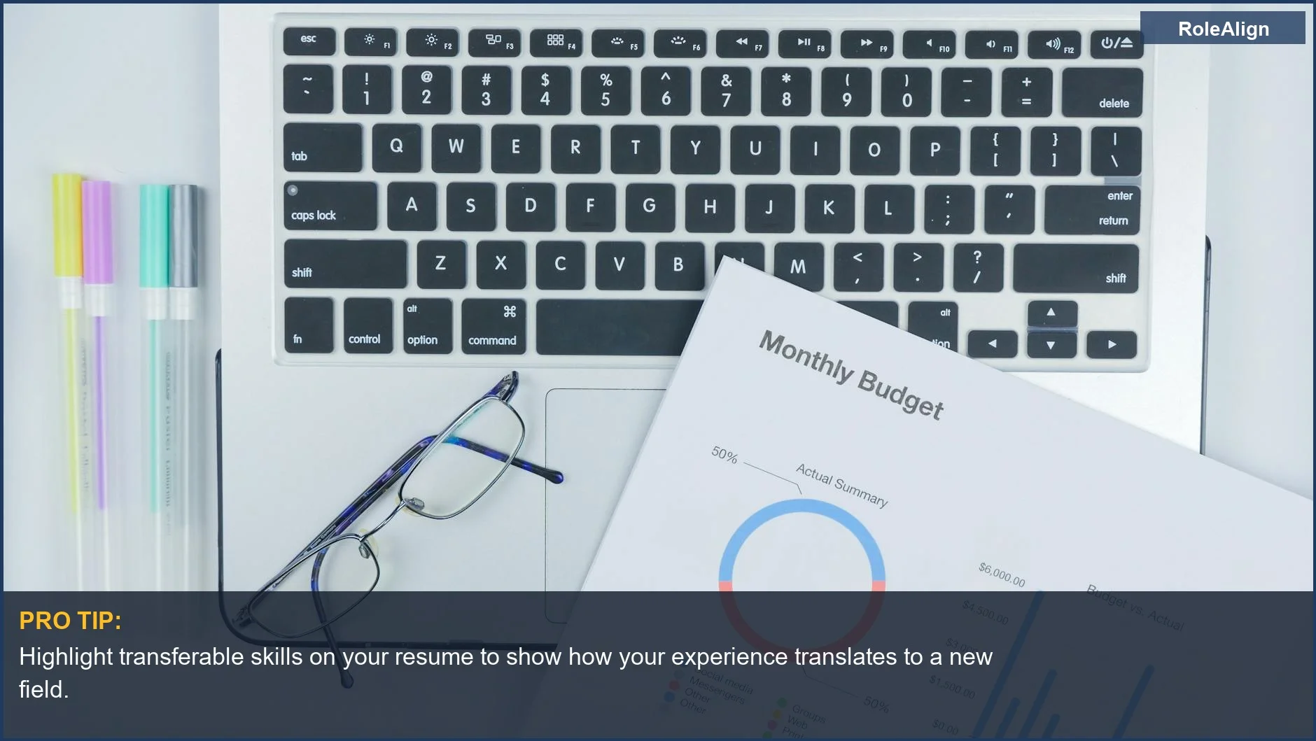 Modern office desk with laptop, reports, and glasses, illustrating how to make a career pivot.