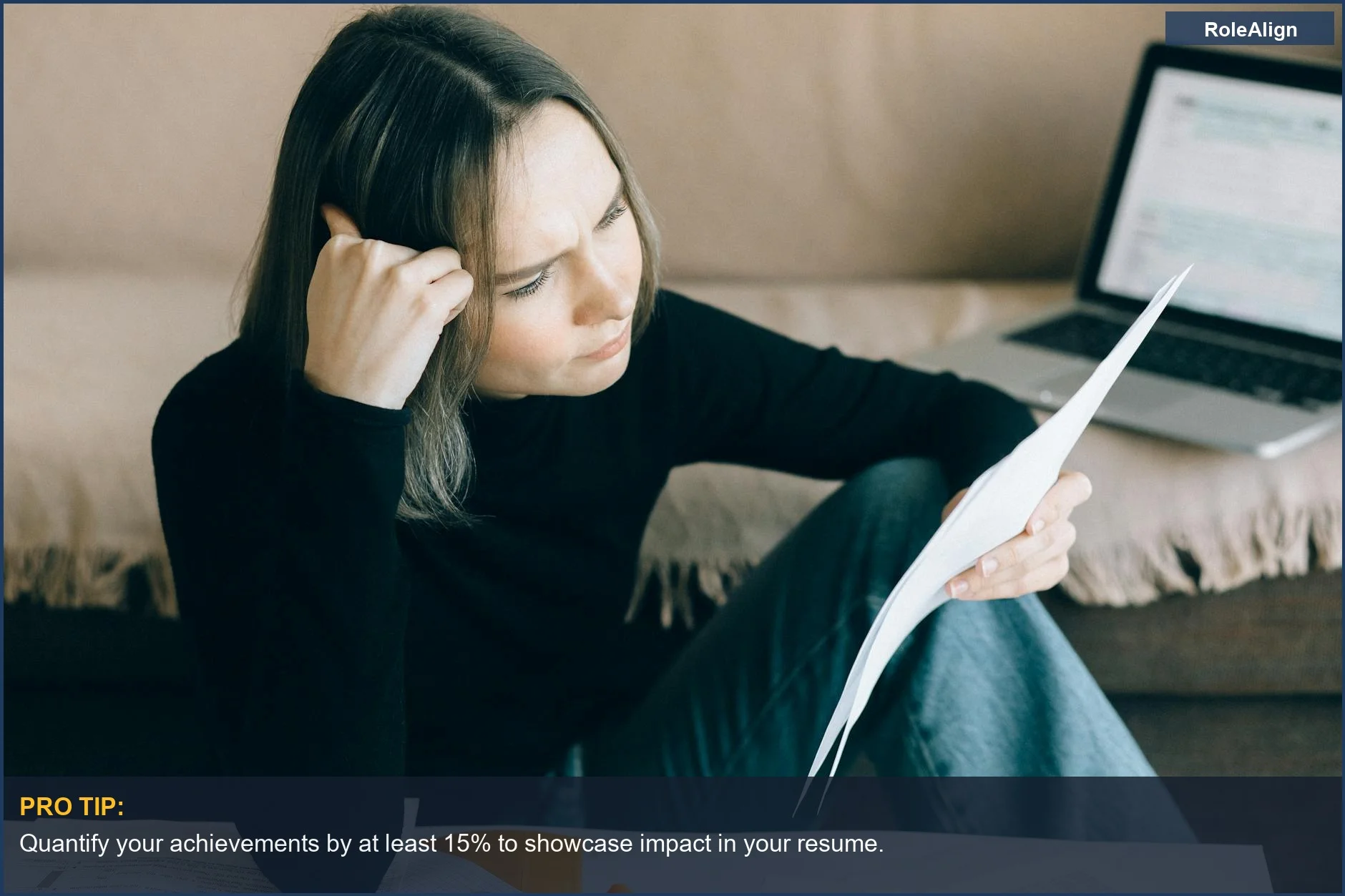 Focused woman analyzing documents with laptop, demonstrating analytical skills for career pivot in her 30s.