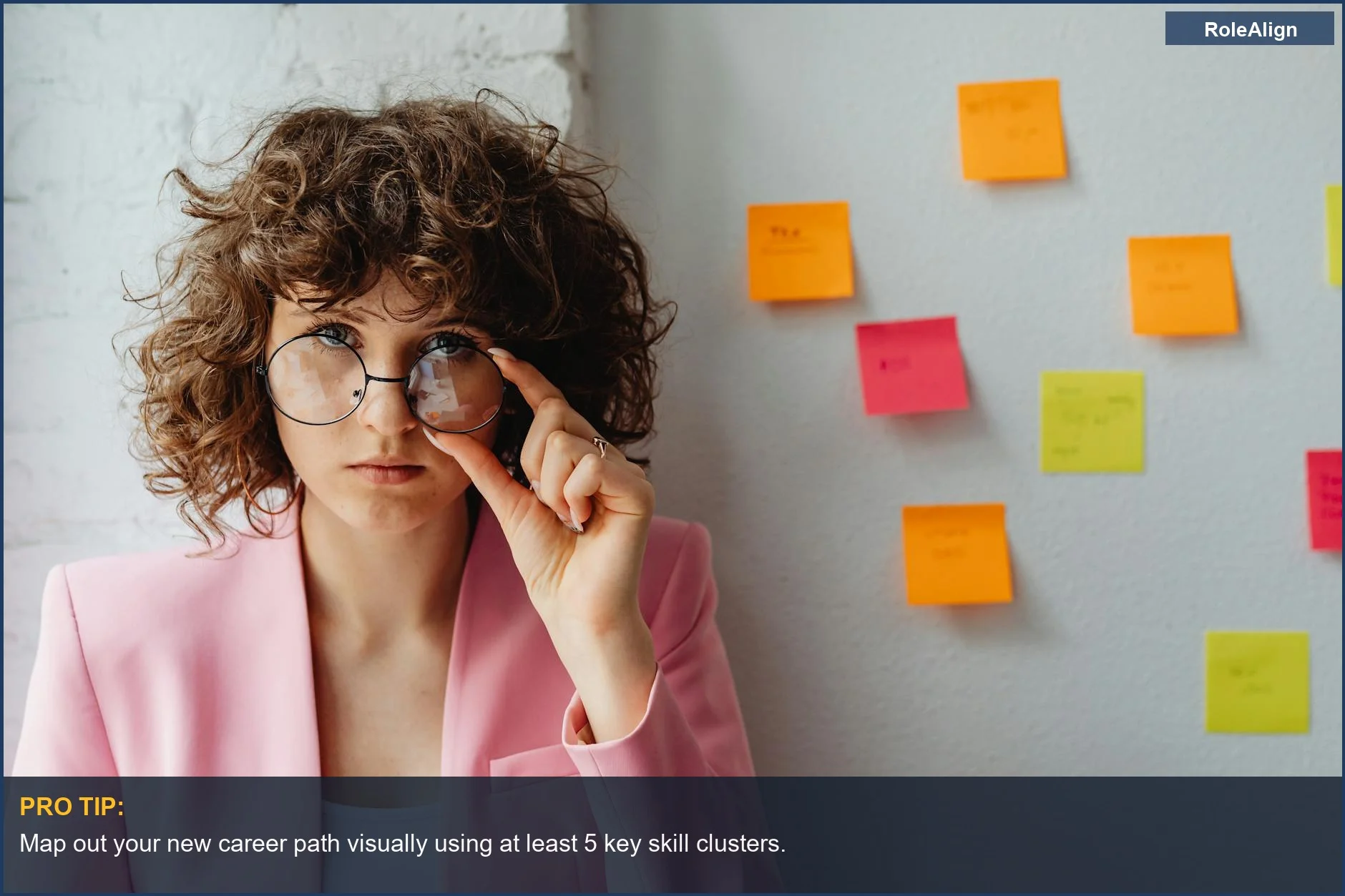Young woman brainstorming ideas on sticky notes, visualizing career change strategies in her 30s.