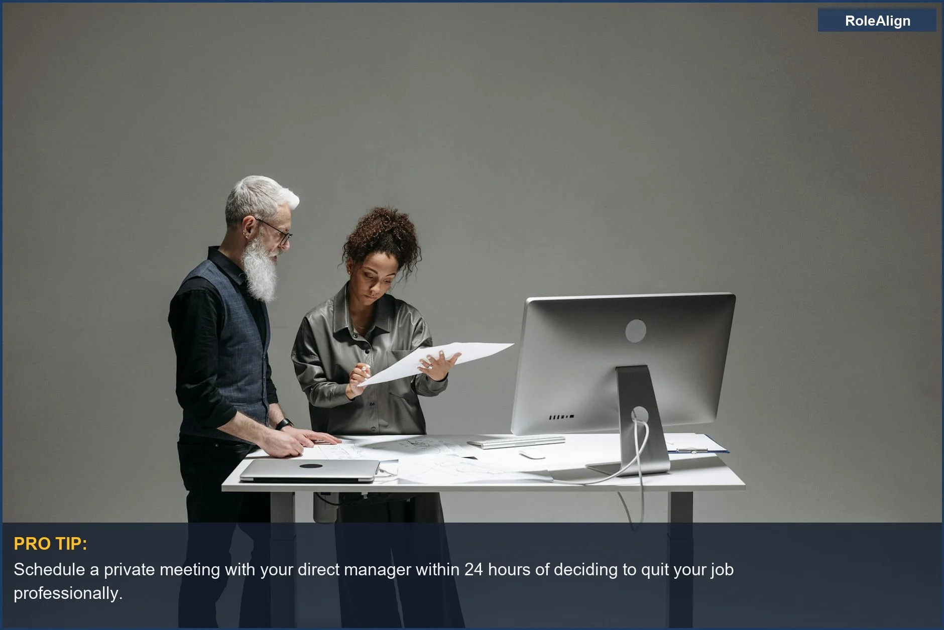 Diverse team collaborating over documents at a large monitor, emphasizing communication before resigning.