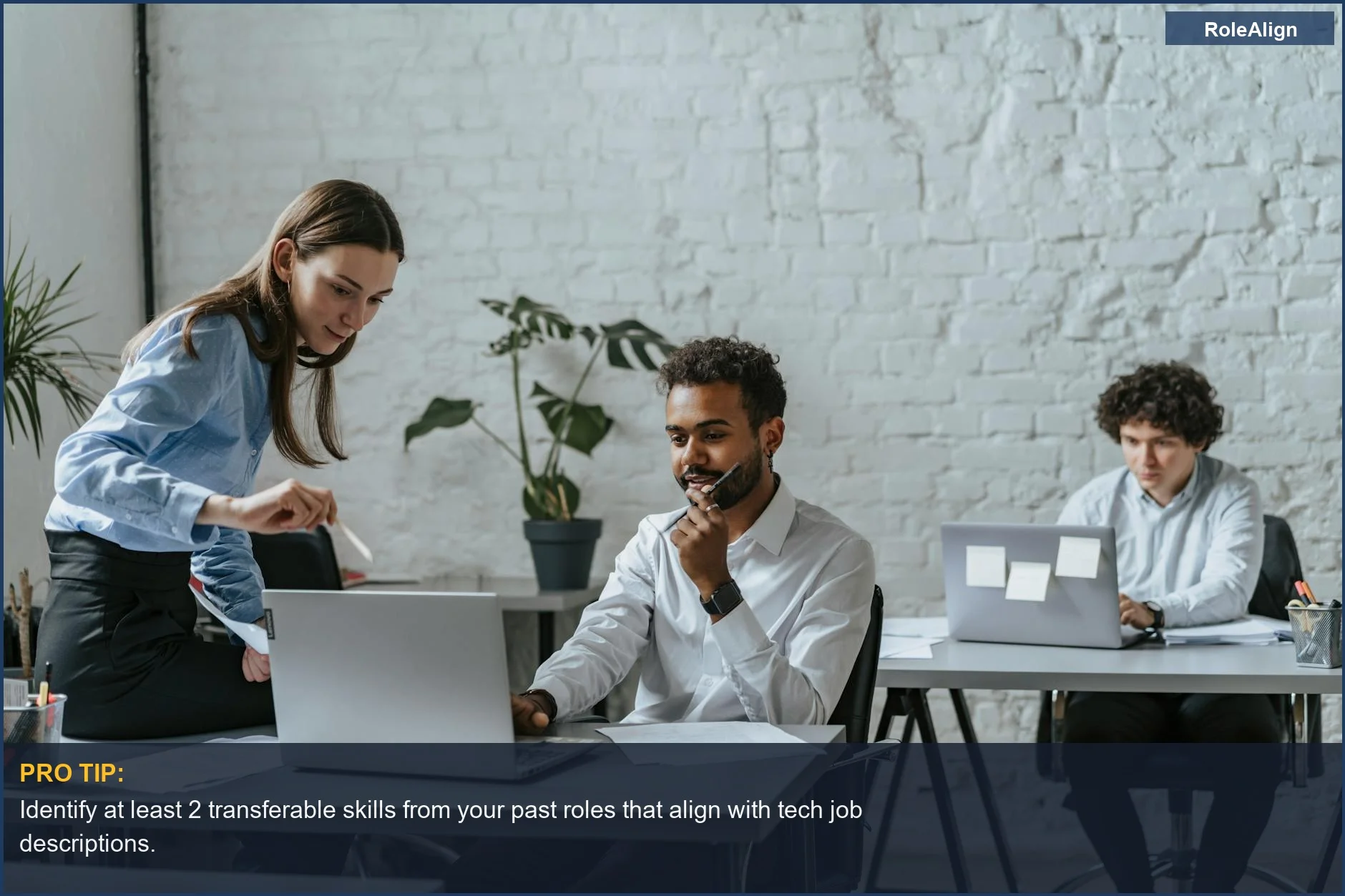 Professionals actively engage with technology and teamwork during a modern office collaboration session.
