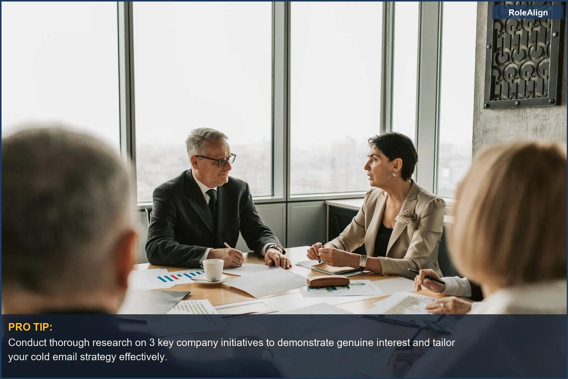 Business professionals in a modern office, planning strategies to enhance cold email strategy and engagement.