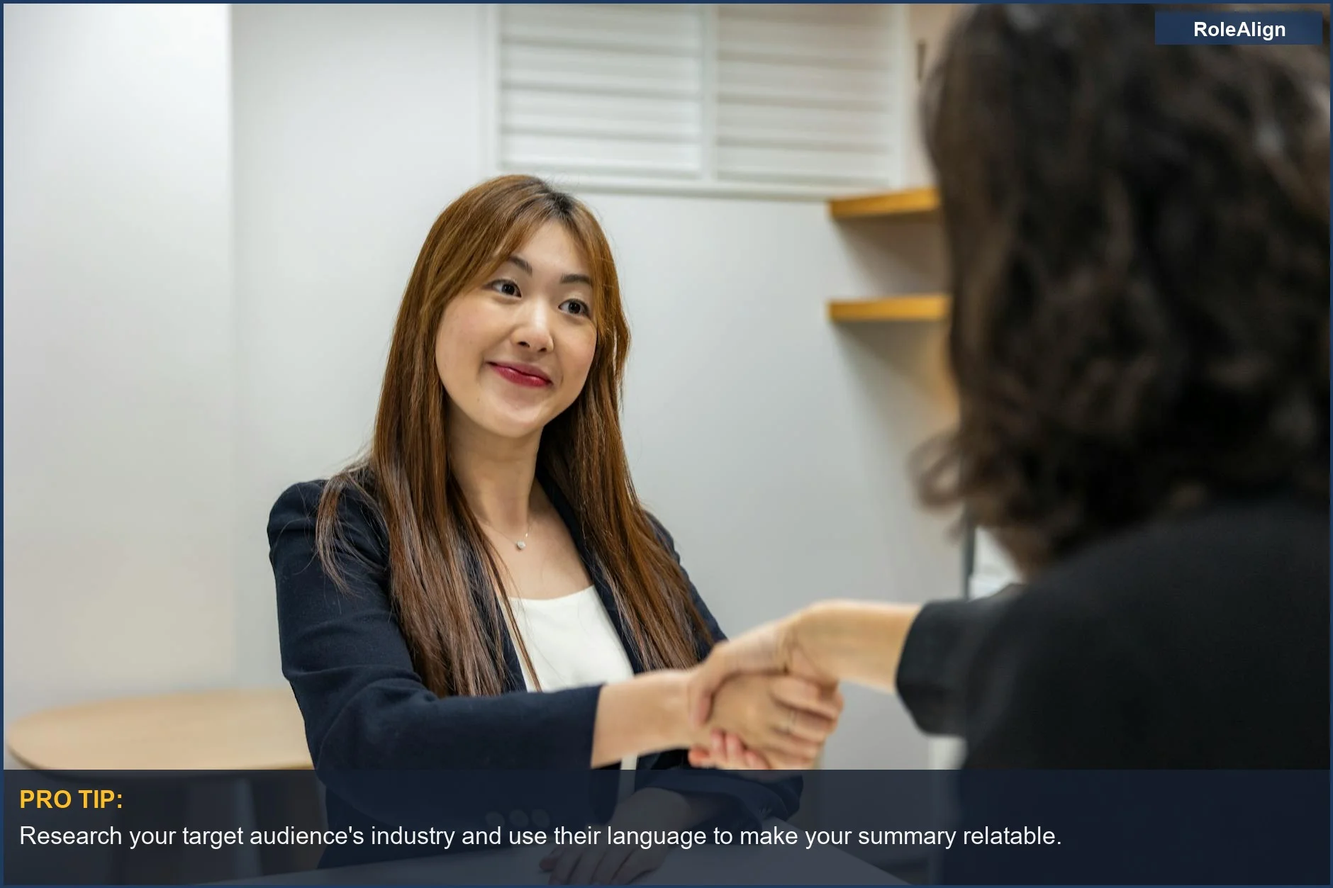 Businesswoman shaking hands with recruiter, emphasizing the importance of a standout linkedin summary.