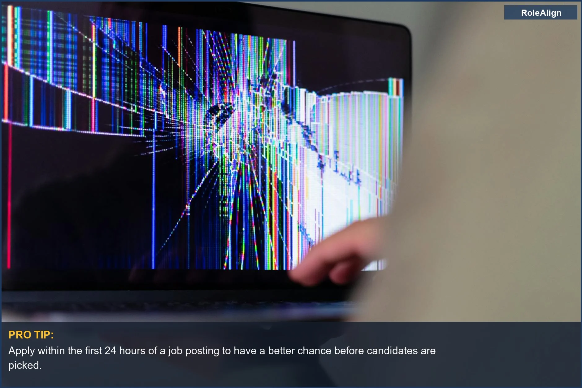 Cracked laptop screen with digital distortion, symbolizing the unfairness of a job already filled.