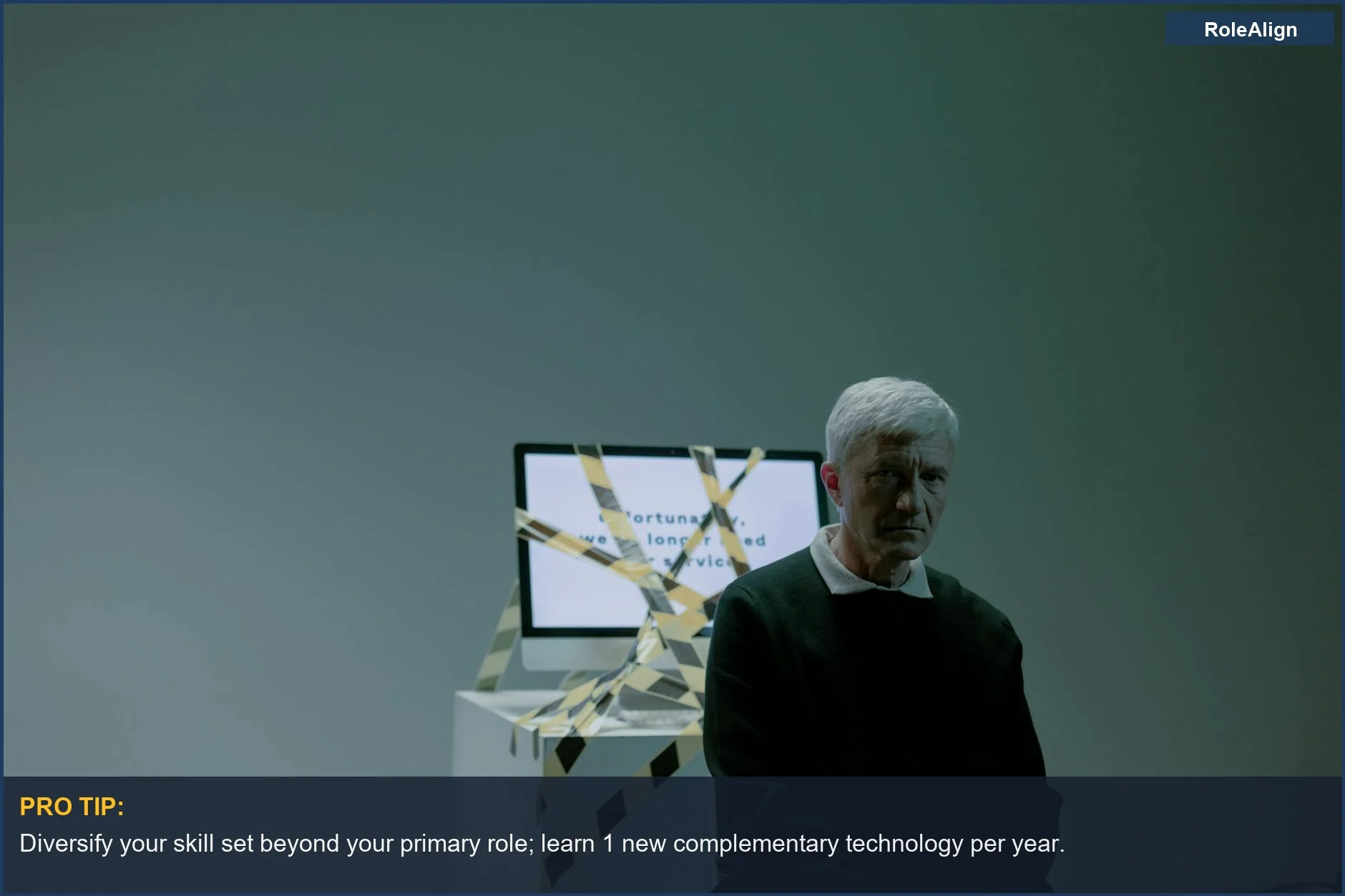 Senior man by computer wrapped in caution tape, representing job loss from 2025 layoffs.