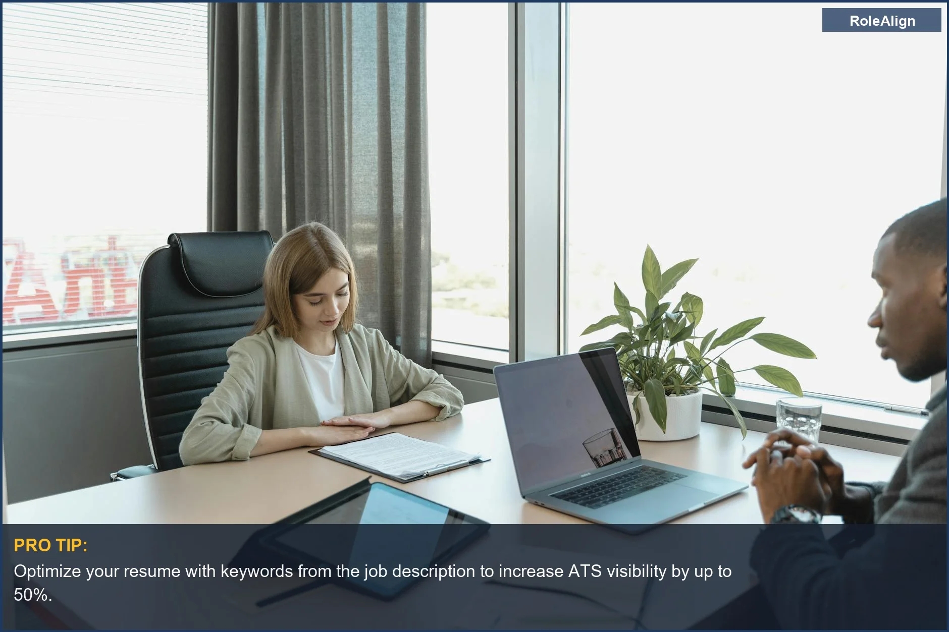 Diverse team in a modern office discussing candidates during the recruit CRM hiring process.