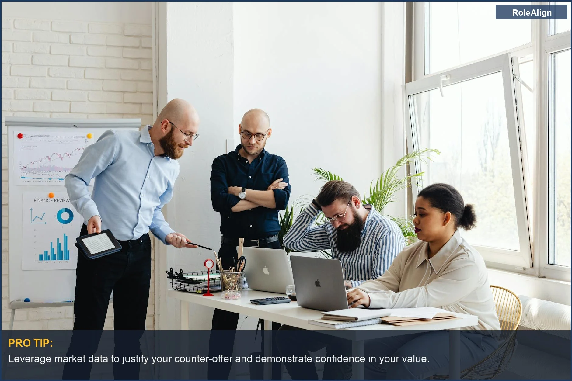 Diverse business team strategizing in an office, discussing salary negotiation insights.