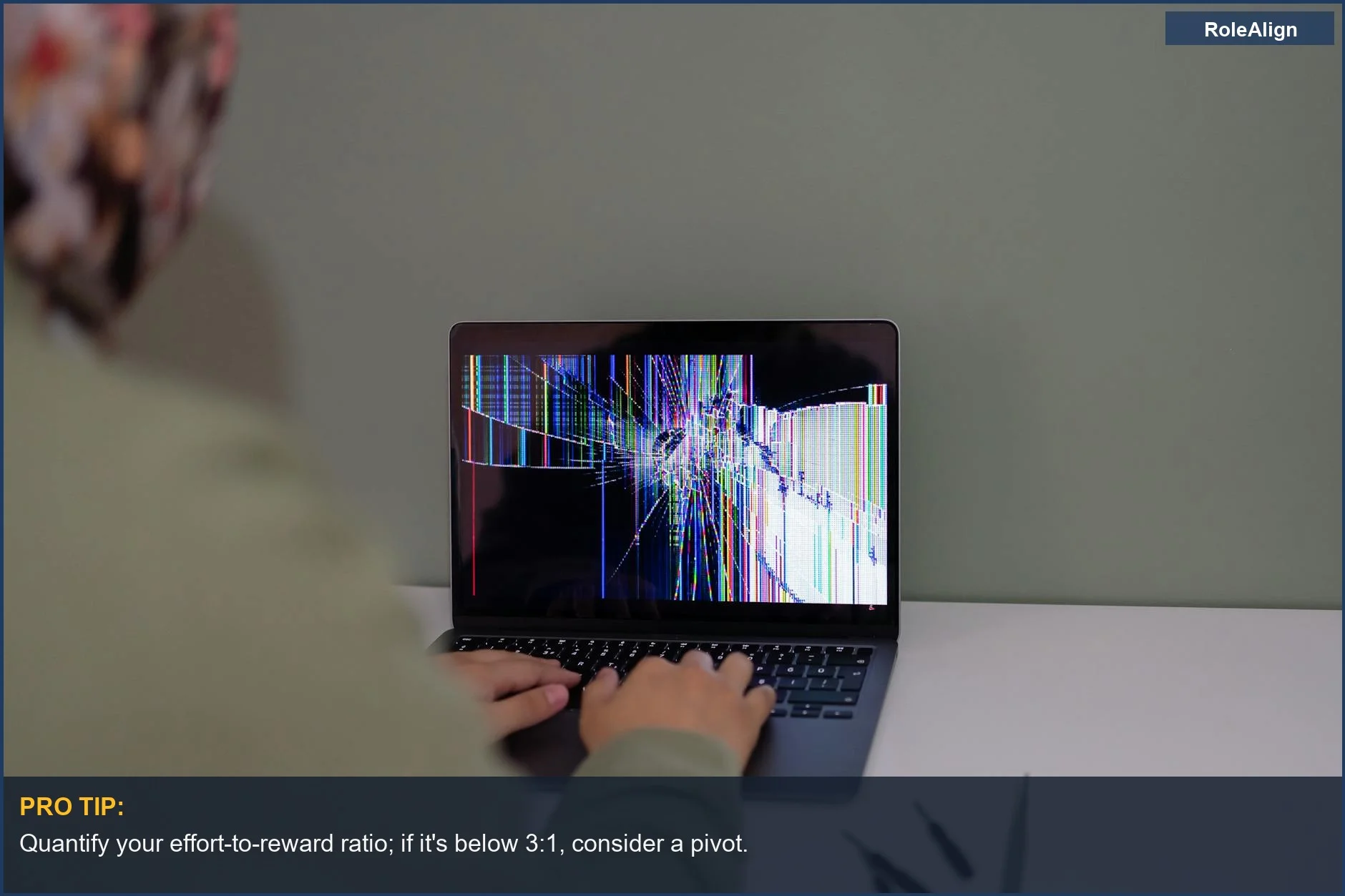 Adult working on laptop with cracked screen--a clear sign it's time to pivot your approach.