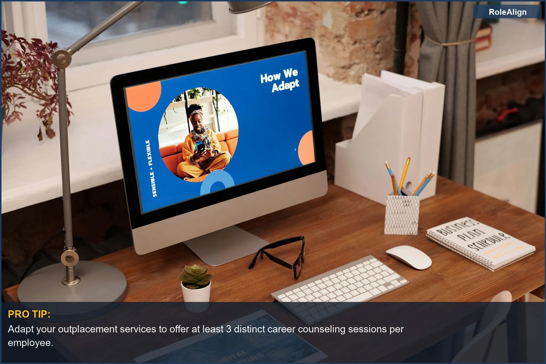 Cozy office with a desktop displaying 'How We Adapt', symbolizing adapting to changes and employment termination challenges.