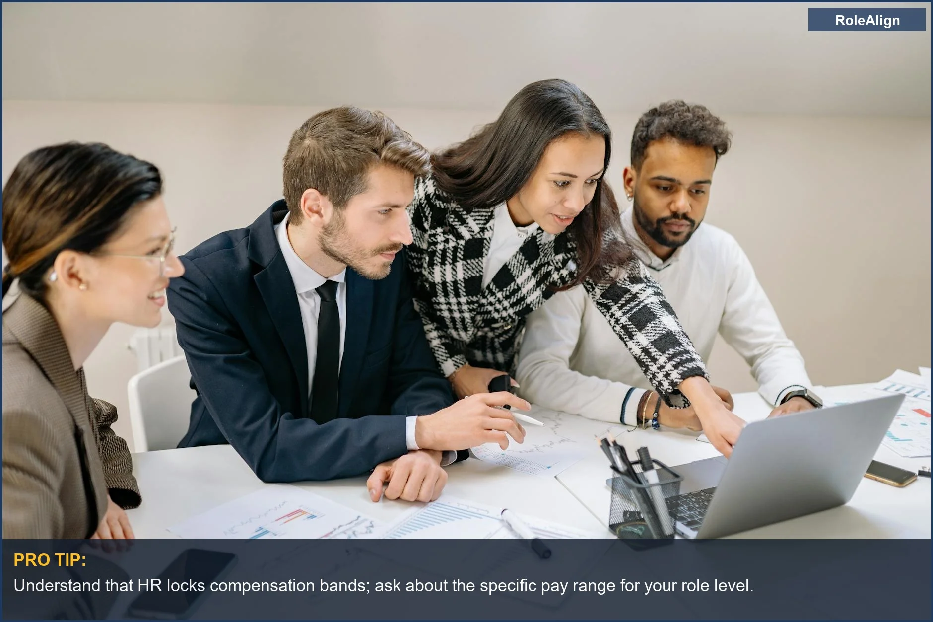 Diverse team analyzing charts and data, illustrating the structured pay ranges behind dream job offers.