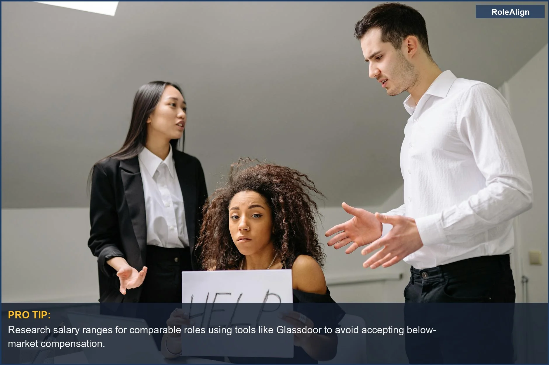 Woman holding 'HELP' sign in office conflict, representing the hidden emotional costs of accepting a dream job.