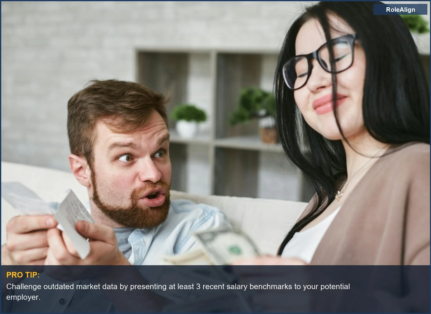 Interracial couple arguing over bills and cash at home, highlighting financial strain from accepting a lowball salary.