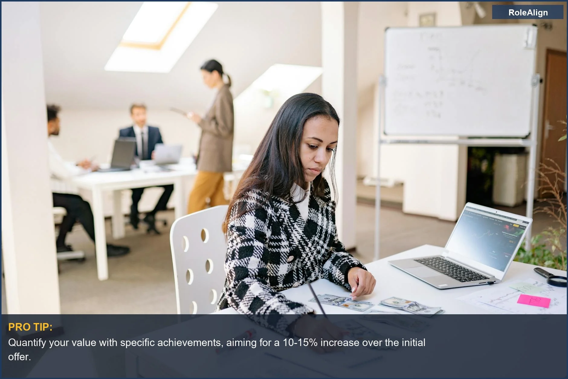 Businesswoman analyzing salary data, highlighting psychological leverage in negotiation.