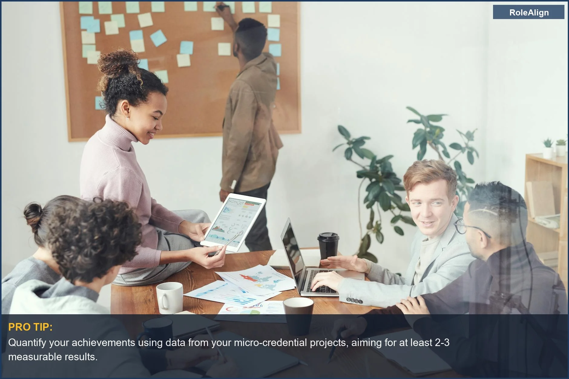 Professionals in a modern office discuss ideas, demonstrating the value of micro-credentials for career change.