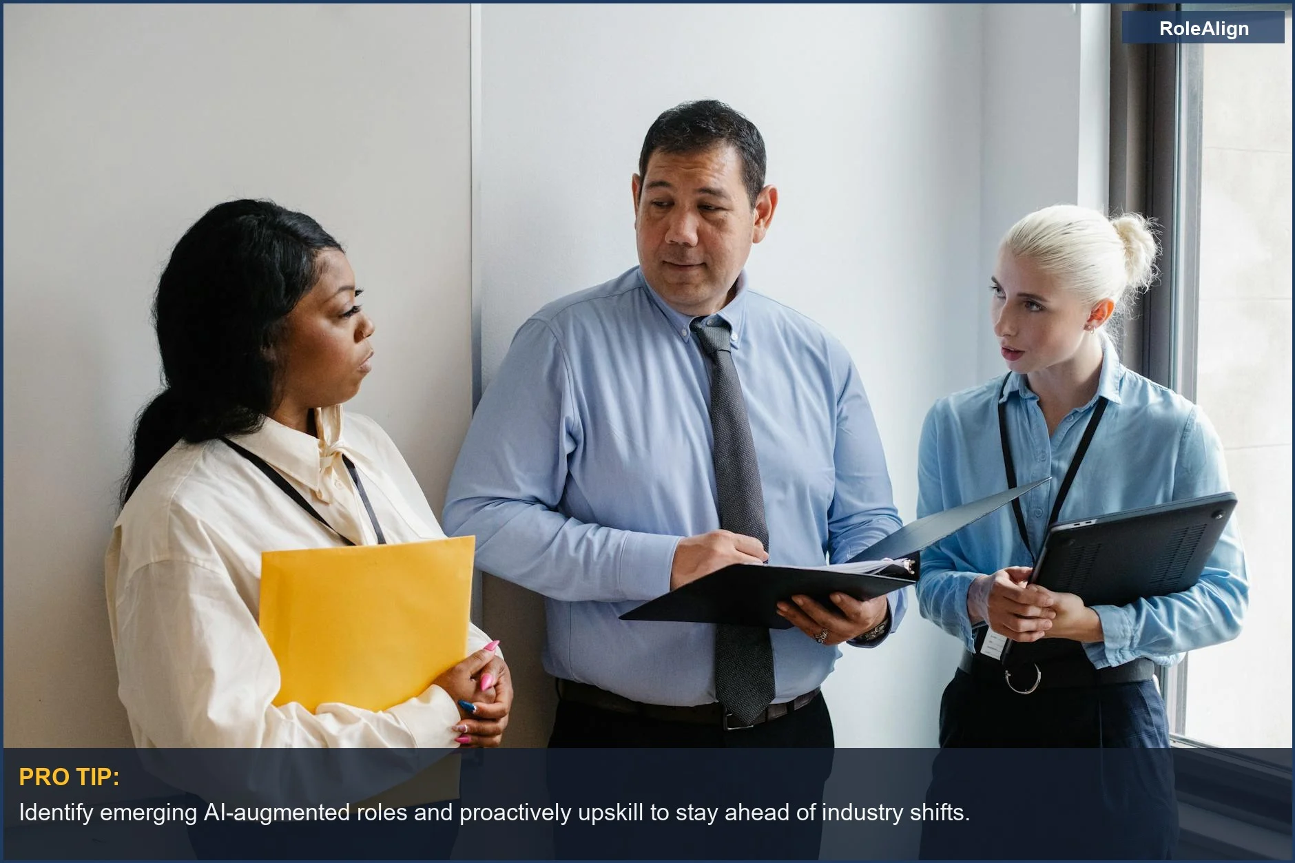 Diverse coworkers discuss project, illustrating AI's impact on skill gaps in the workplace.