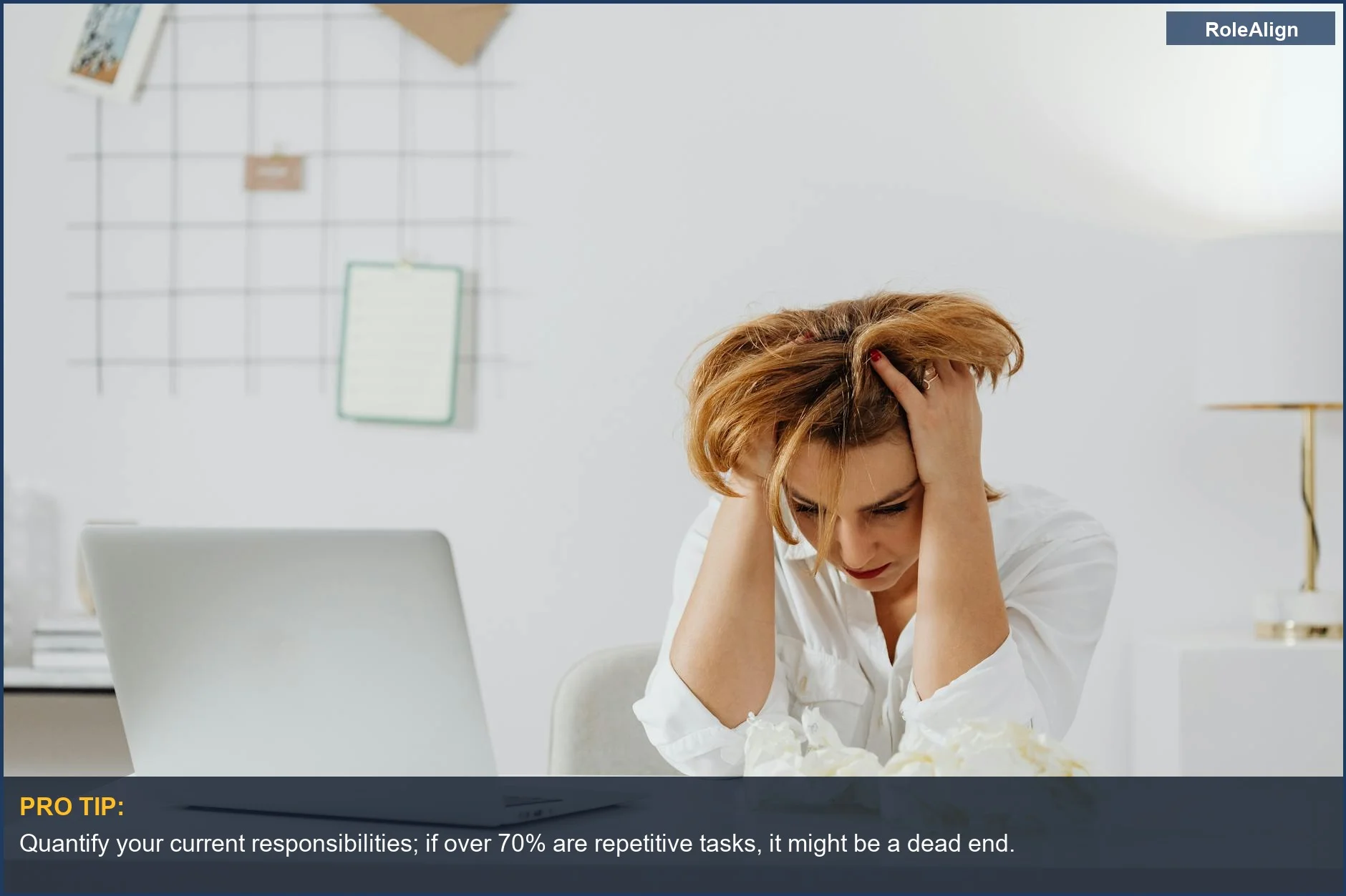 Woman looking frustrated and overwhelmed at her laptop, a common dead end job scenario.
